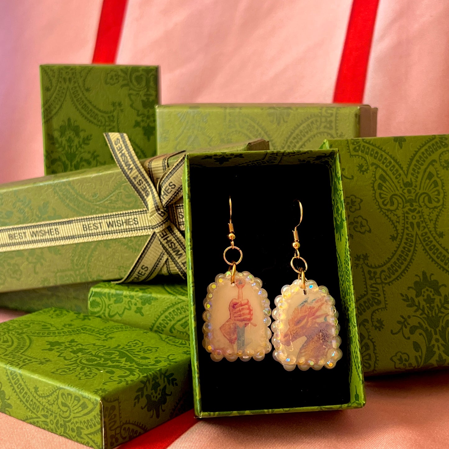 Handcrafted polymer‑clay earrings featuring a peace‑making knight and dragon motif, embellished with iridescent pearl beads, rhinestones, and 18k gold‑plated hypoallergenic findings—perfect whimsical, fairy‑core, fantasy jewelry.