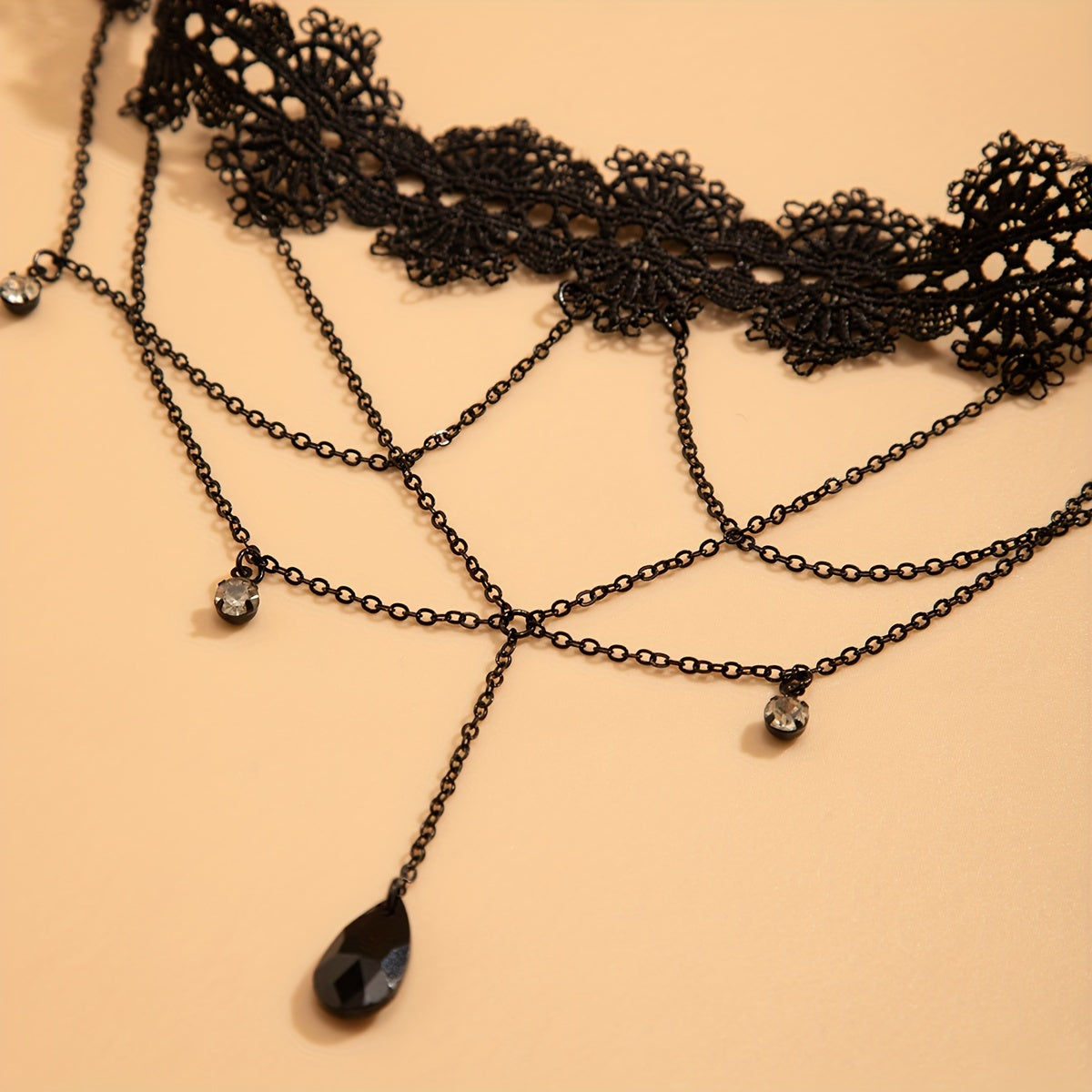 cascading black lace gemmed leg adornment
