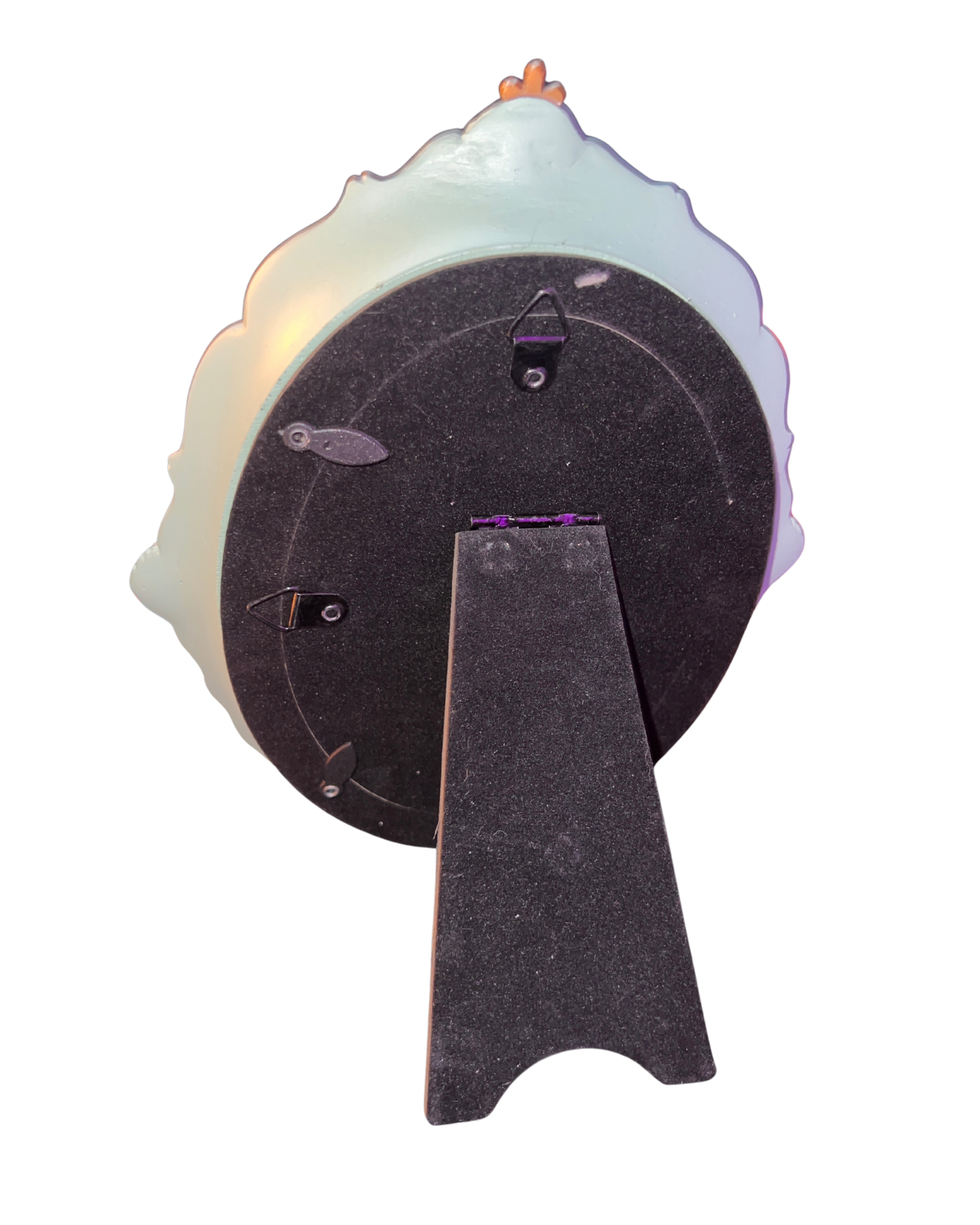 Back view of a clock with a white and black design on a white background