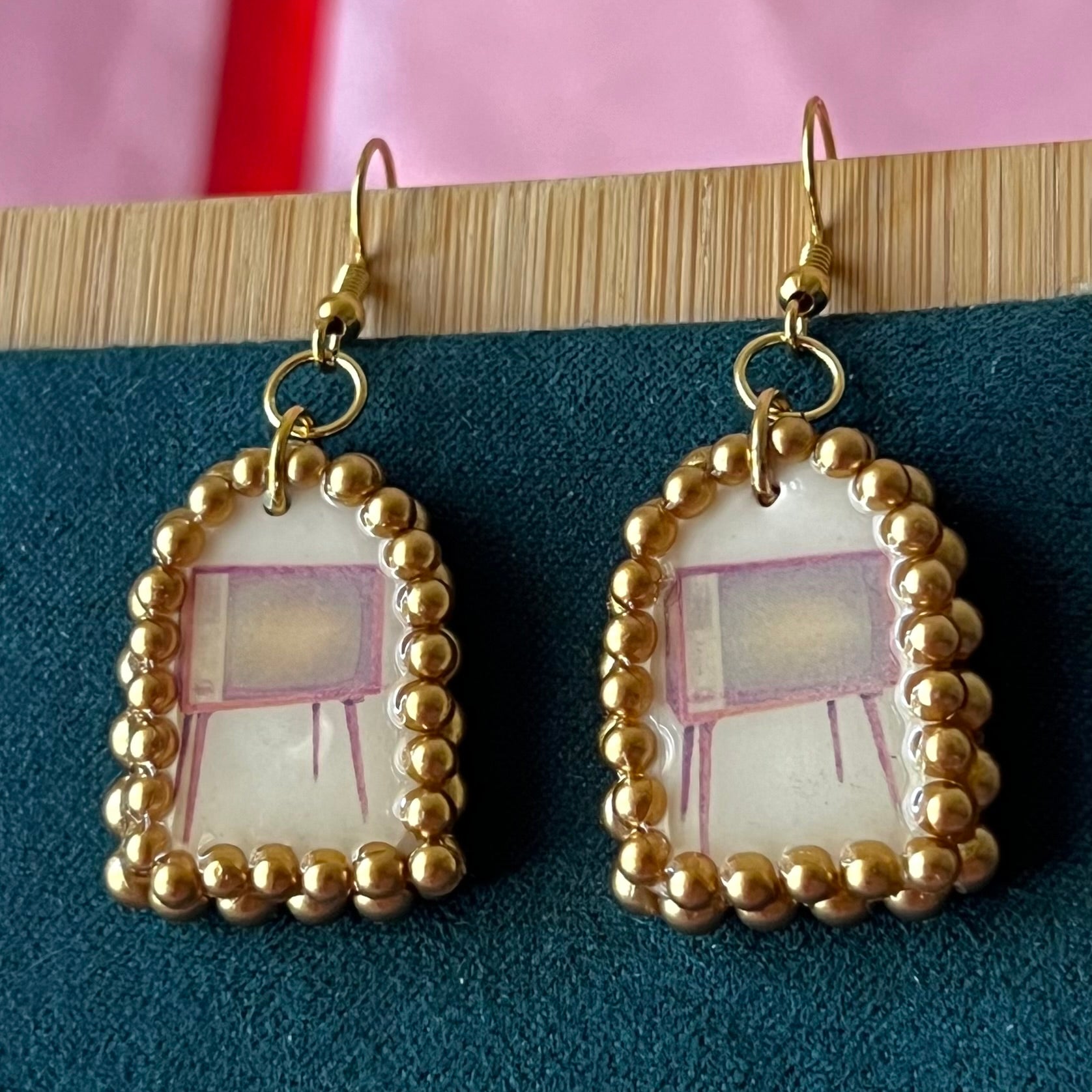 Handmade retro vintage TV charm earrings — pearl‑bedazzled arch dangles with a nostalgic TV graphic, gold/bronze pearl framing and 18k gold‑plated hooks; perfect retro, vintage, Y2K, indie, polymer‑clay statement jewelry.