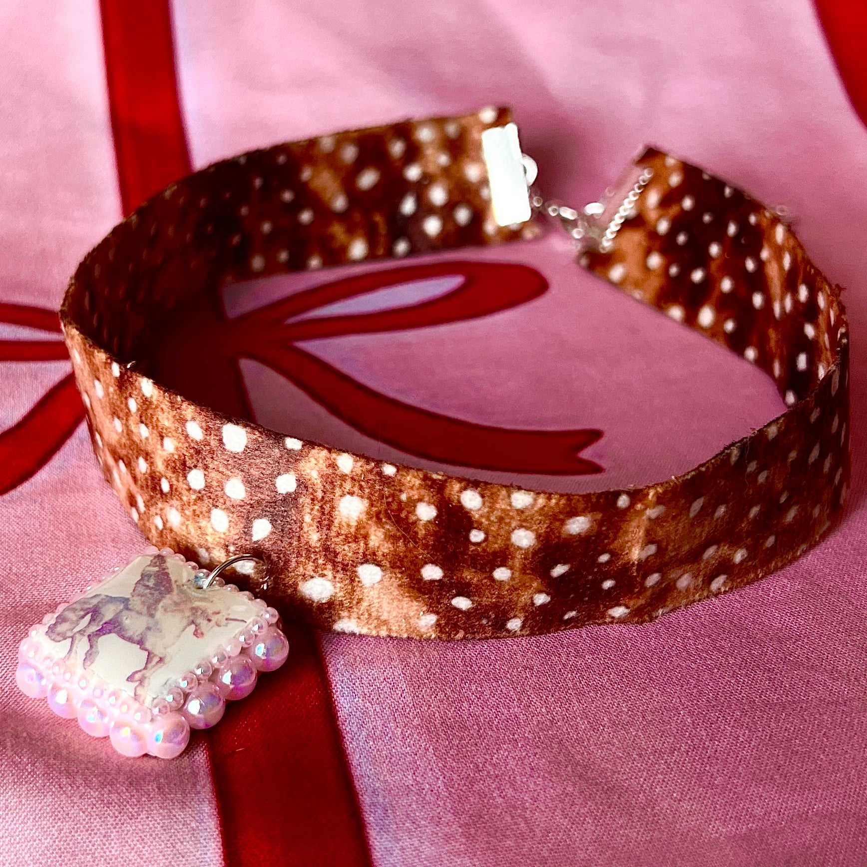 Fawn print pegasus ribbon choker — 14" deer/fawn print ribbon choker with handmade pink polymer clay pegasus charm bedazzled with iridescent pearls, plus extension chain for adjustable fit. Gift-ready green Victorian box. Coquette fairycore Y2K choke necklace; ready to ship in 1–3 days.