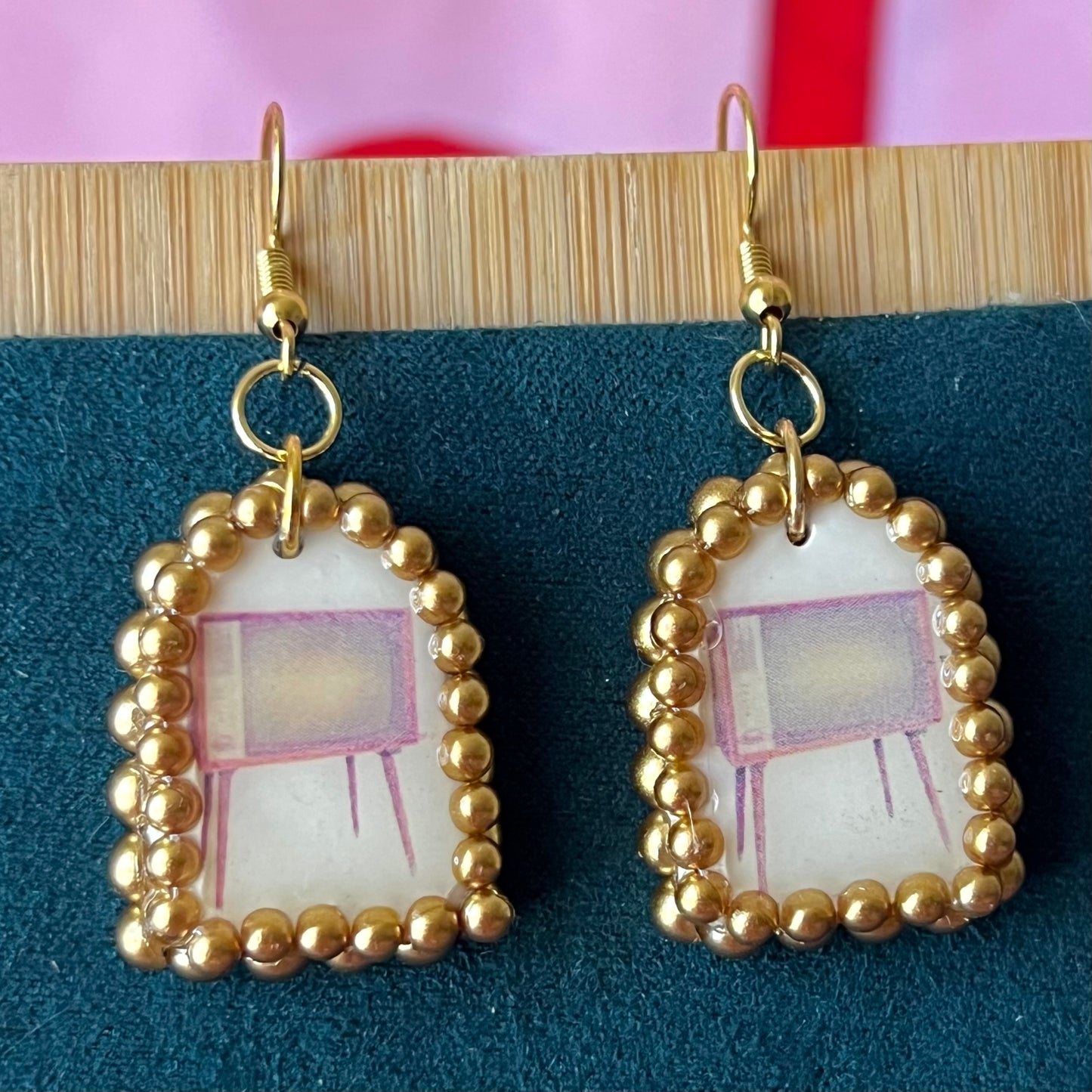 Handmade retro vintage TV charm earrings — pearl‑bedazzled arch dangles with a nostalgic TV graphic, gold/bronze pearl framing and 18k gold‑plated hooks; perfect retro, vintage, Y2K, indie, polymer‑clay statement jewelry.