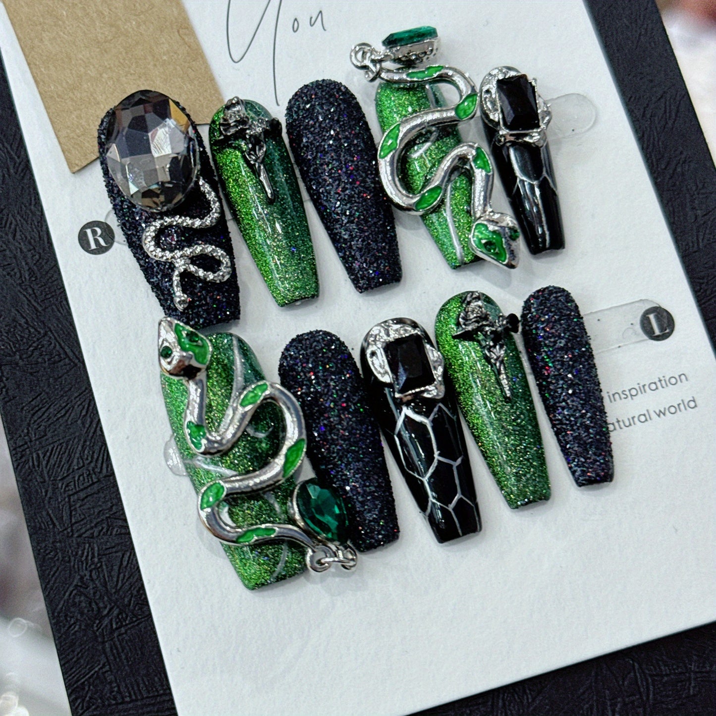 glimmering serpent nail adornment