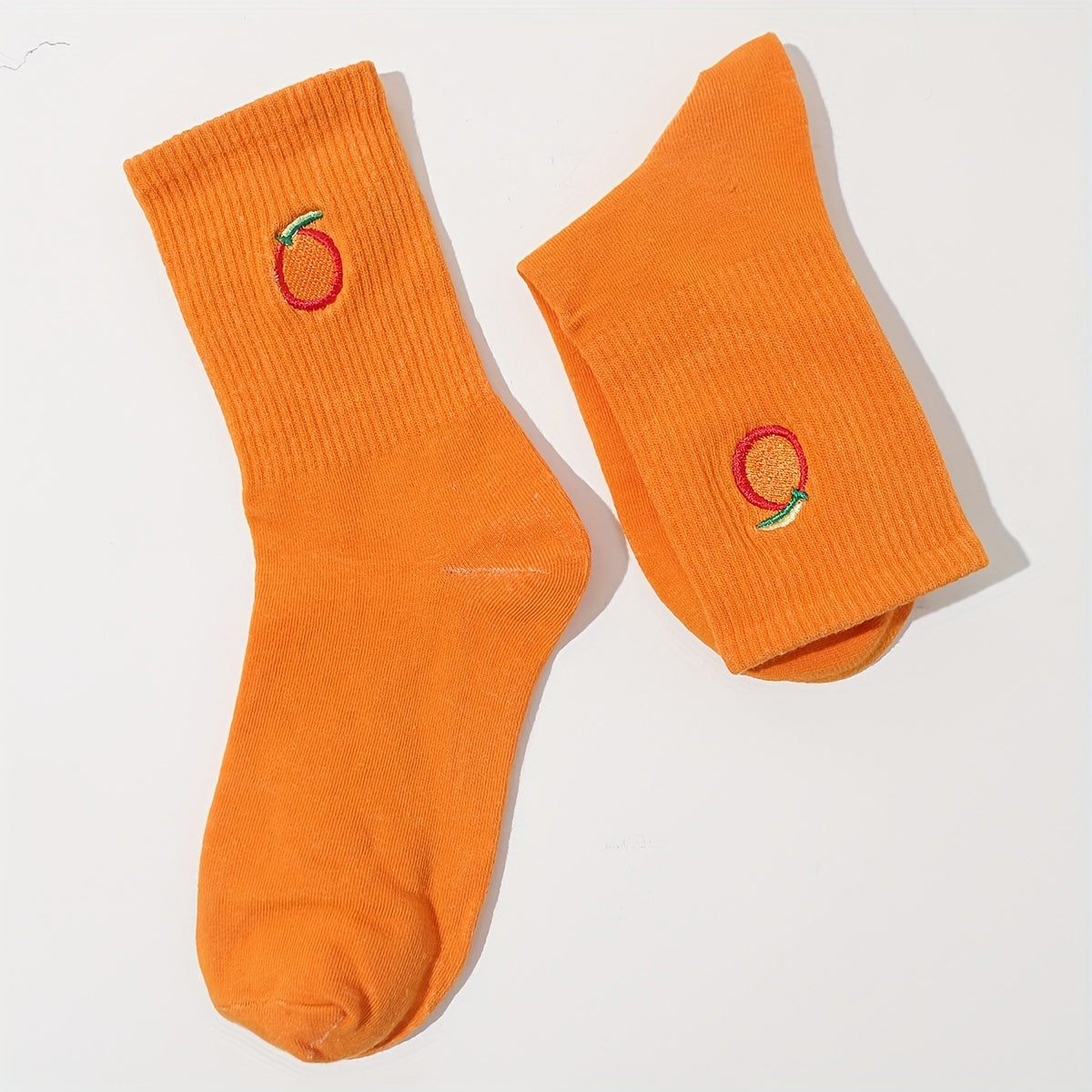 "orange you glad not to see these dogs" pair of socks