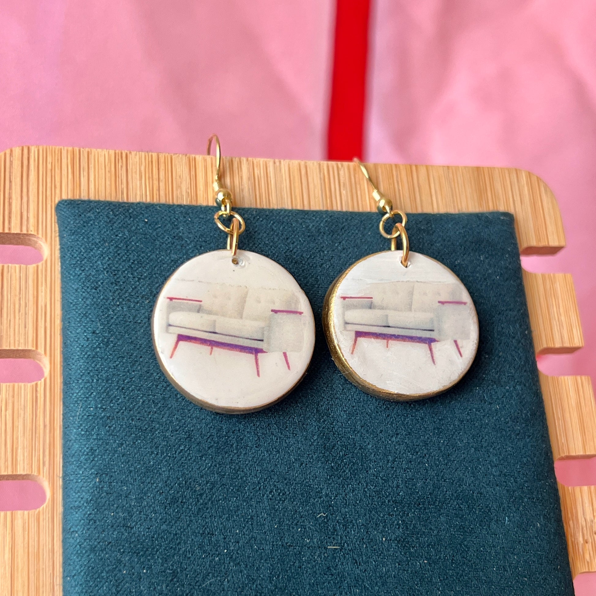 Handmade white couch earrings—polymer‑clay mini sofa charms painted with metallic gold, featuring gold‑plated hypoallergenic hooks; perfect retro Y2K dreamcore jewelry for quirky, miniature‑object lovers.