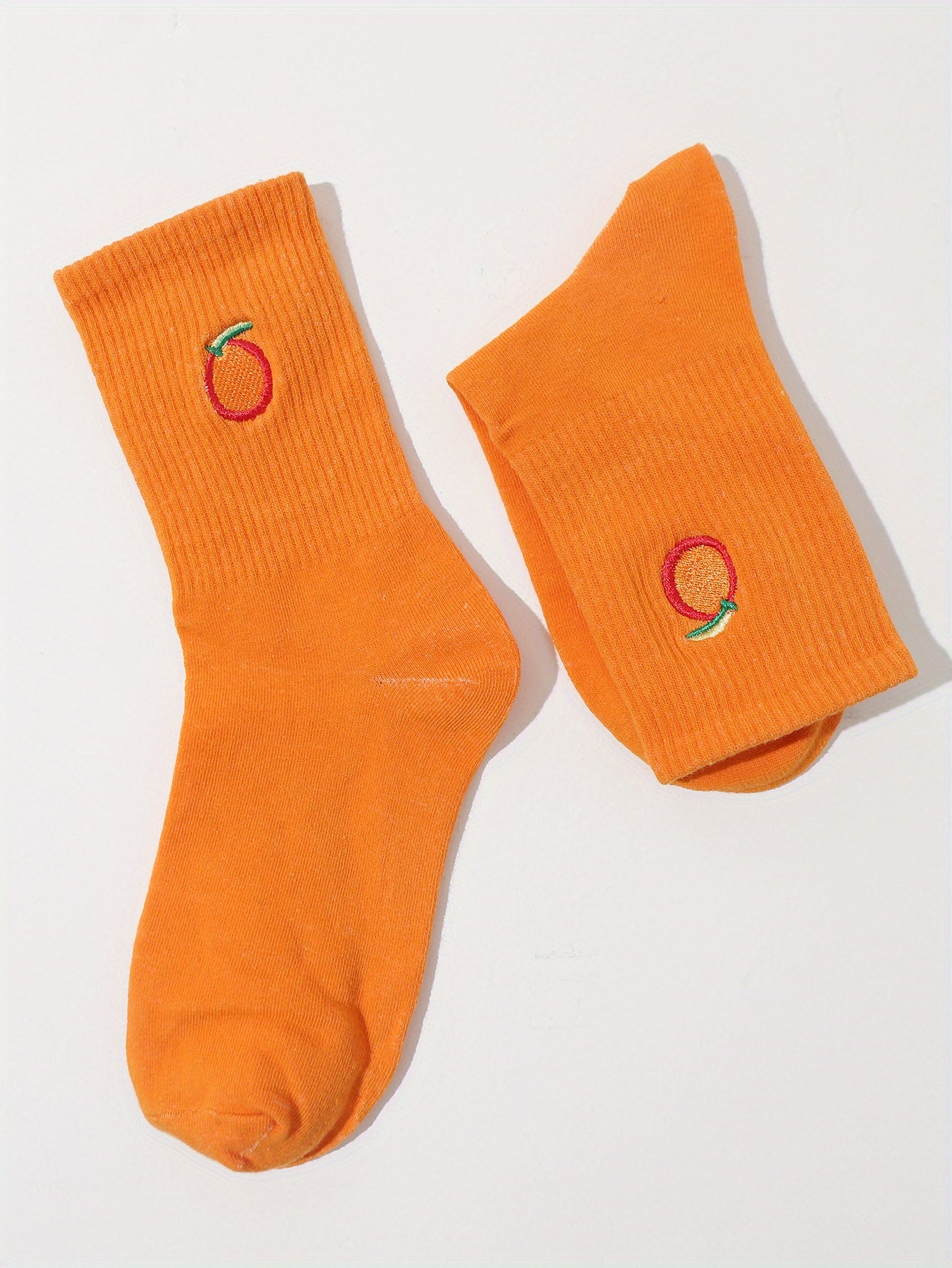 "orange you glad not to see these dogs" pair of socks