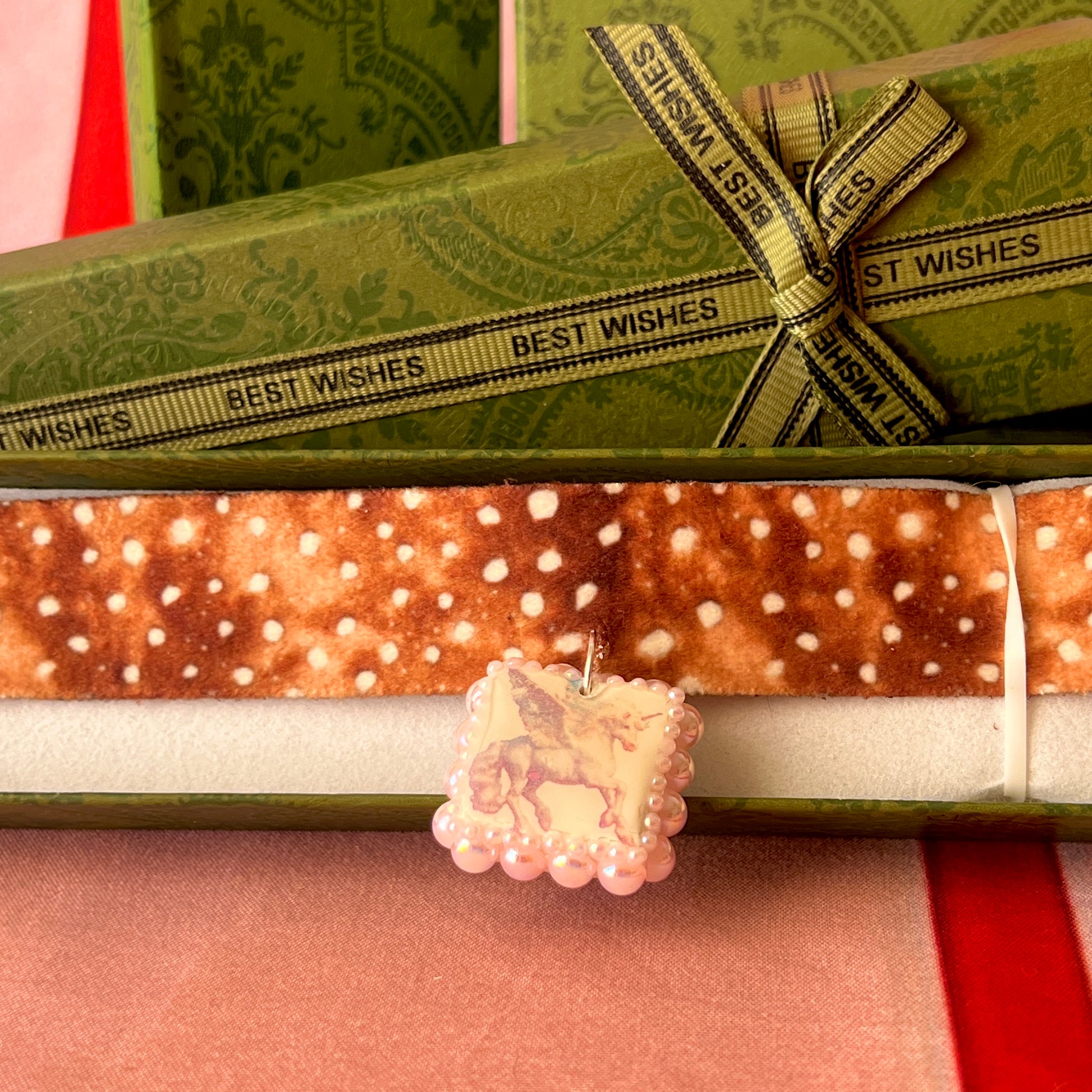 Fawn print pegasus ribbon choker — 14" deer/fawn print ribbon choker with handmade pink polymer clay pegasus charm bedazzled with iridescent pearls, plus extension chain for adjustable fit. Gift-ready green Victorian box. Coquette fairycore Y2K choke necklace; ready to ship in 1–3 days.