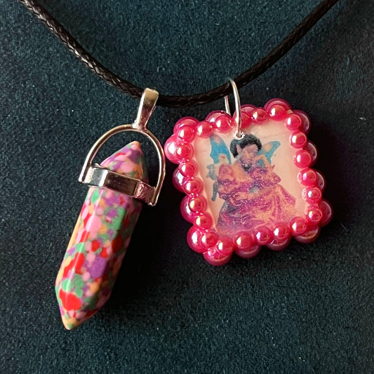 Confetti crystal fairy necklace — rainbow “confetti” crystal pendant paired with tiny blue fairy charm, hand-bedazzled with iridescent pearls + rhinestones for portal sparkle. Gift-ready Victorian-patterned box. Fairycore whimsigoth Y2K charm necklace by Olive Made; ready to ship in 1–3 days.