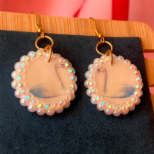 Alt text: “Iridescent swan charm earrings—handmade polymer clay swan dangle earrings bedazzled with iridescent beads, featuring 18k gold plated hypoallergenic hooks—perfect fairycore, coquette, cottagecore, whimsigoth, and Y2K style.”