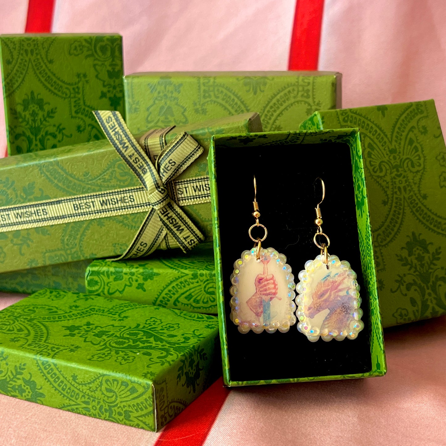 Handcrafted polymer‑clay earrings featuring a peace‑making knight and dragon motif, embellished with iridescent pearl beads, rhinestones, and 18k gold‑plated hypoallergenic findings—perfect whimsical, fairy‑core, fantasy jewelry.
