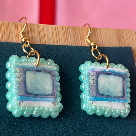 Handmade retro vintage TV charm earrings — pearl‑bedazzled arch dangles with a nostalgic TV graphic, gold/bronze pearl framing and 18k gold‑plated hooks; perfect retro, vintage, Y2K, indie, polymer‑clay statement jewelry.