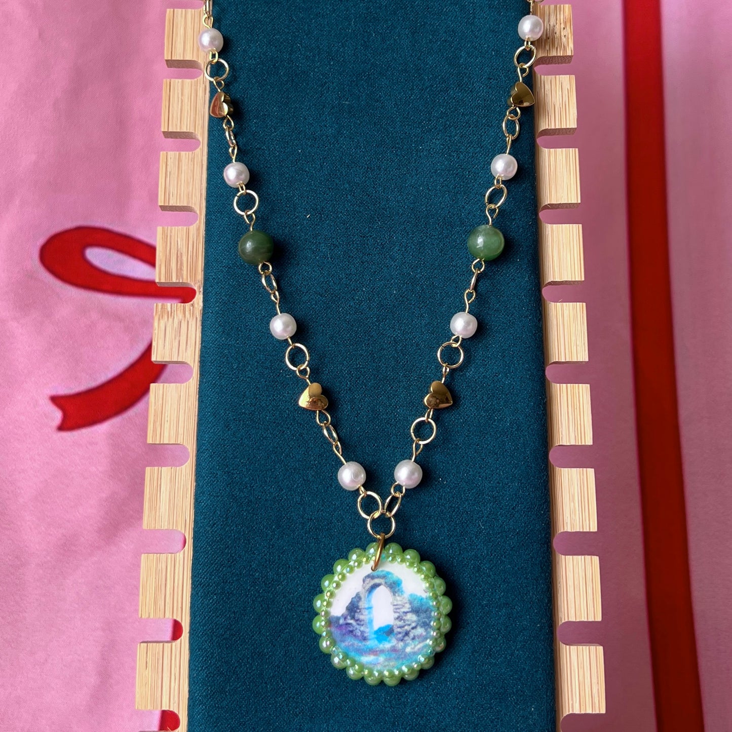 Magical archway charm necklace — one-of-a-kind medieval stone archway “portal” pendant hand-sculpted in polymer clay (approx. 1" tall x 0.75" wide) and bedazzled with iridescent pearls and rhinestones. Handmade wearable magic.