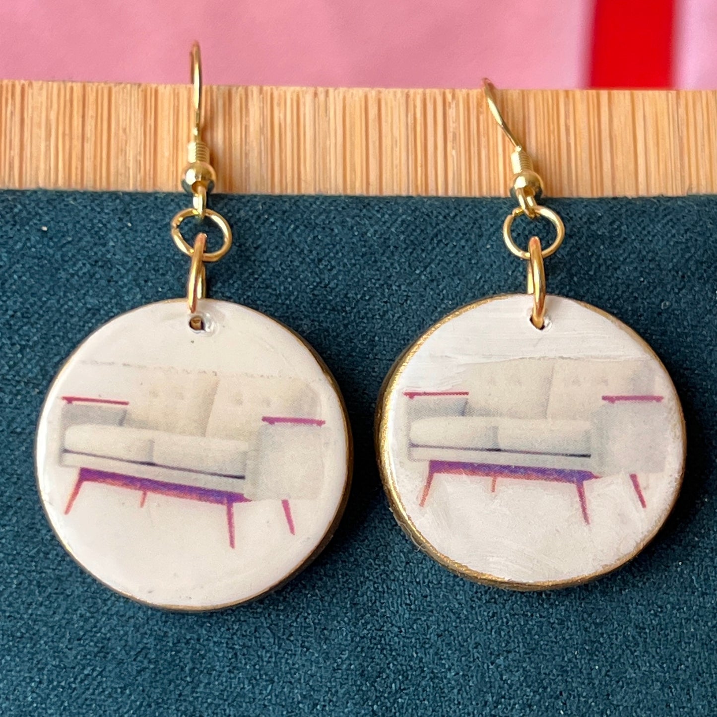 Handmade white couch earrings—polymer‑clay mini sofa charms painted with metallic gold, featuring gold‑plated hypoallergenic hooks; perfect retro Y2K dreamcore jewelry for quirky, miniature‑object lovers.