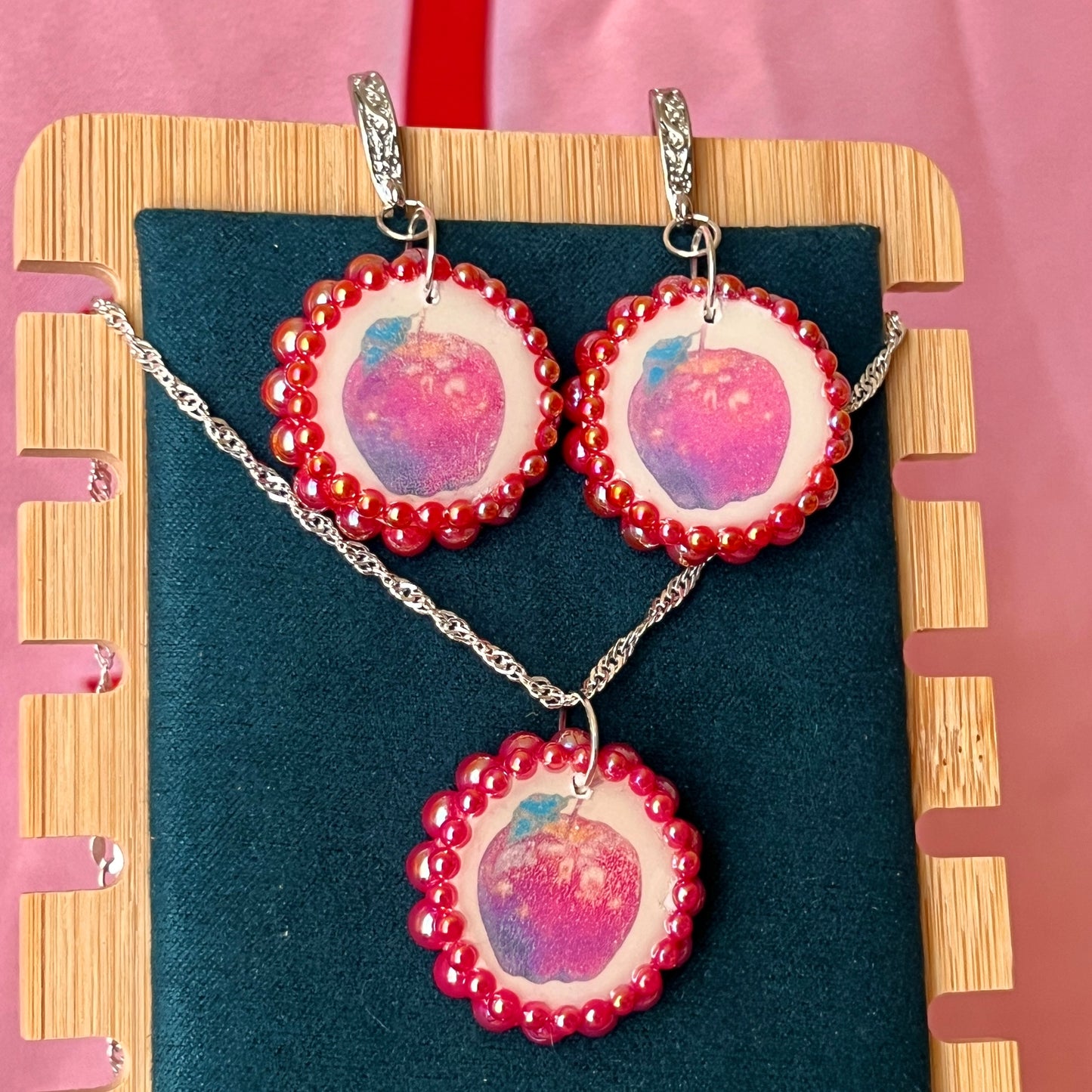 Apple charm earrings & necklace set — handmade polymer clay apple charms bedazzled with iridescent red pearls. Earrings have ornate silver-plated hooks; necklace is on 20" 925 sterling silver chain. Sold separately or as gift set; coquette fruitcore Y2K jewelry. Ready to ship in 1–3 business days.