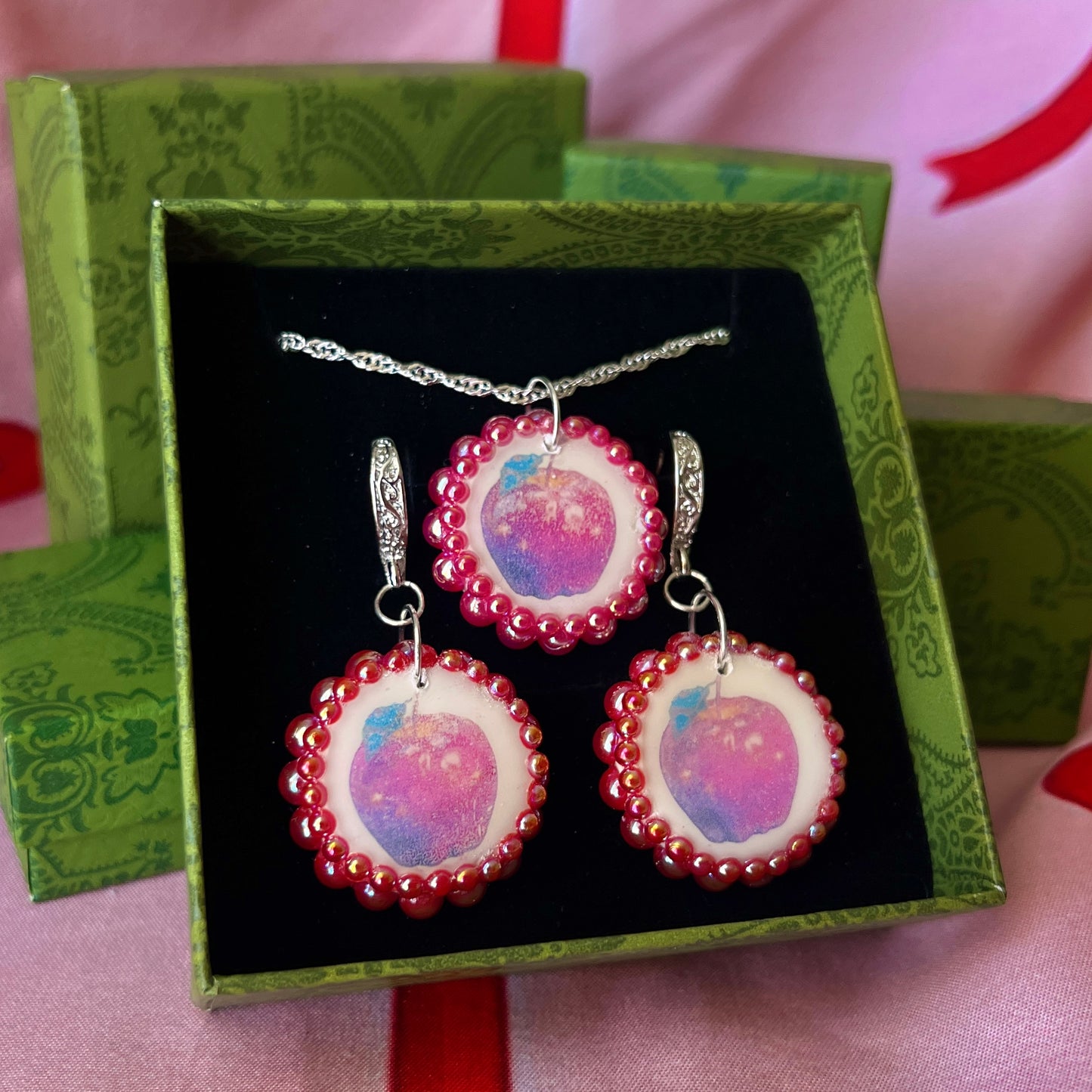 Apple charm earrings & necklace set — handmade polymer clay apple charms bedazzled with iridescent red pearls. Earrings have ornate silver-plated hooks; necklace is on 20" 925 sterling silver chain. Sold separately or as gift set; coquette fruitcore Y2K jewelry. Ready to ship in 1–3 business days.