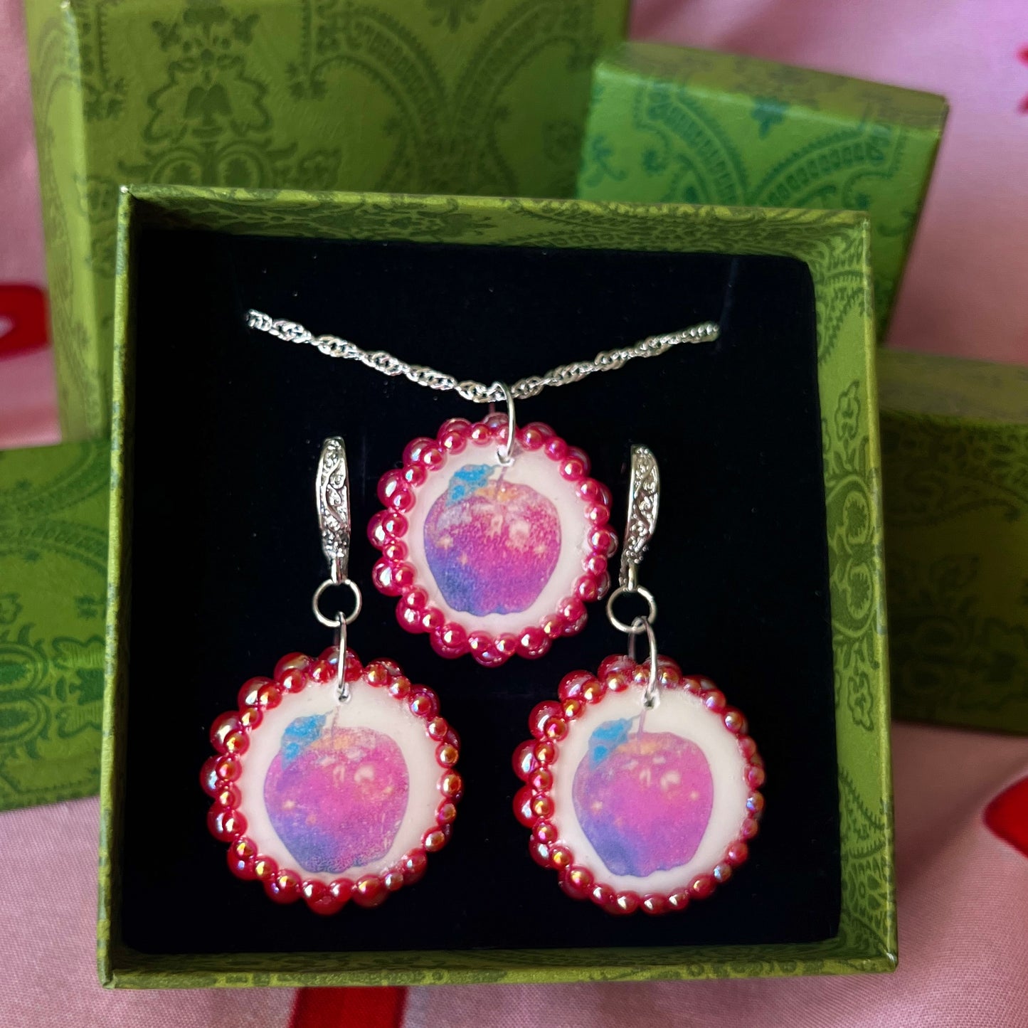 Apple charm earrings & necklace set — handmade polymer clay apple charms bedazzled with iridescent red pearls. Earrings have ornate silver-plated hooks; necklace is on 20" 925 sterling silver chain. Sold separately or as gift set; coquette fruitcore Y2K jewelry. Ready to ship in 1–3 business days.