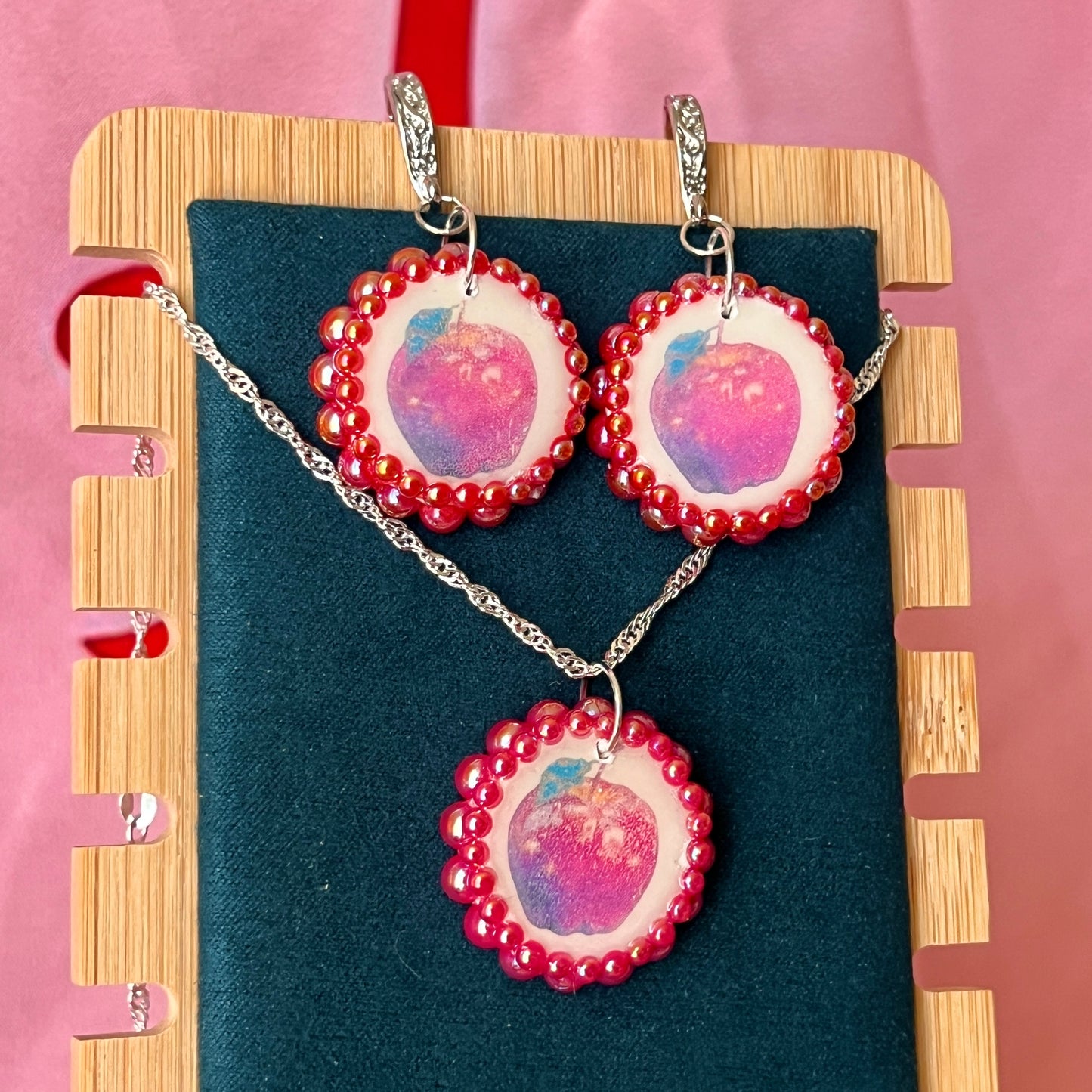 Apple charm earrings & necklace set — handmade polymer clay apple charms bedazzled with iridescent red pearls. Earrings have ornate silver-plated hooks; necklace is on 20" 925 sterling silver chain. Sold separately or as gift set; coquette fruitcore Y2K jewelry. Ready to ship in 1–3 business days.