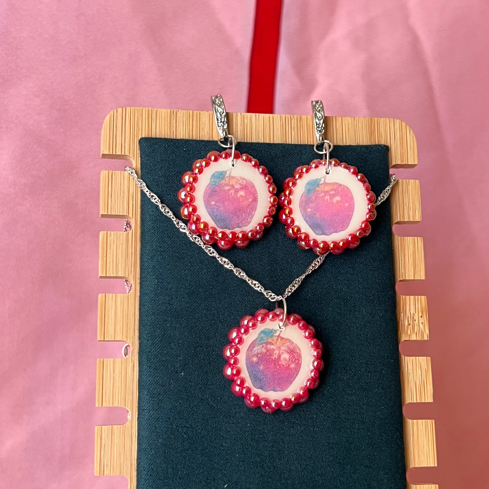 Apple charm earrings & necklace set — handmade polymer clay apple charms bedazzled with iridescent red pearls. Earrings have ornate silver-plated hooks; necklace is on 20" 925 sterling silver chain. Sold separately or as gift set; coquette fruitcore Y2K jewelry. Ready to ship in 1–3 business days.