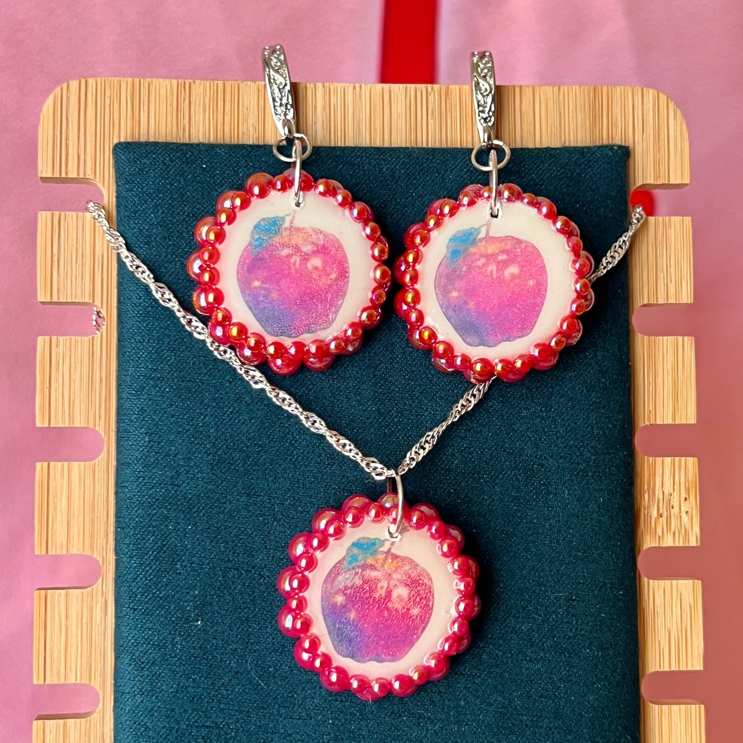 Apple charm earrings & necklace set — handmade polymer clay apple charms bedazzled with iridescent red pearls. Earrings have ornate silver-plated hooks; necklace is on 20" 925 sterling silver chain. Sold separately or as gift set; coquette fruitcore Y2K jewelry. Ready to ship in 1–3 business days.