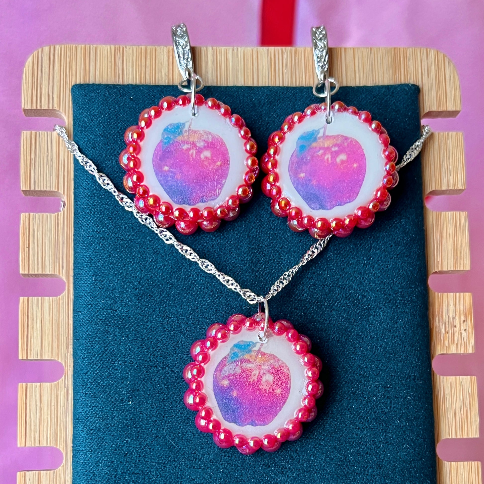 Apple charm earrings & necklace set — handmade polymer clay apple charms bedazzled with iridescent red pearls. Earrings have ornate silver-plated hooks; necklace is on 20" 925 sterling silver chain. Sold separately or as gift set; coquette fruitcore Y2K jewelry. Ready to ship in 1–3 business days.