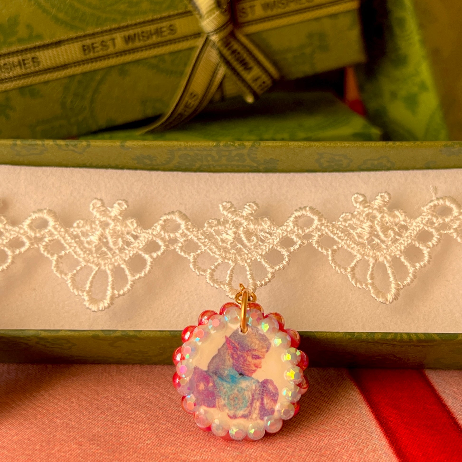 Armored Elf lace choker necklace — handmade polymer clay 3-charm “armored collage” bedazzled with iridescent beads on white lace choker. Gift-ready green Victorian-patterned box. Whimsigoth fairycore coquette cottagecore Y2K choker; ready to ship in 1–3 business days.