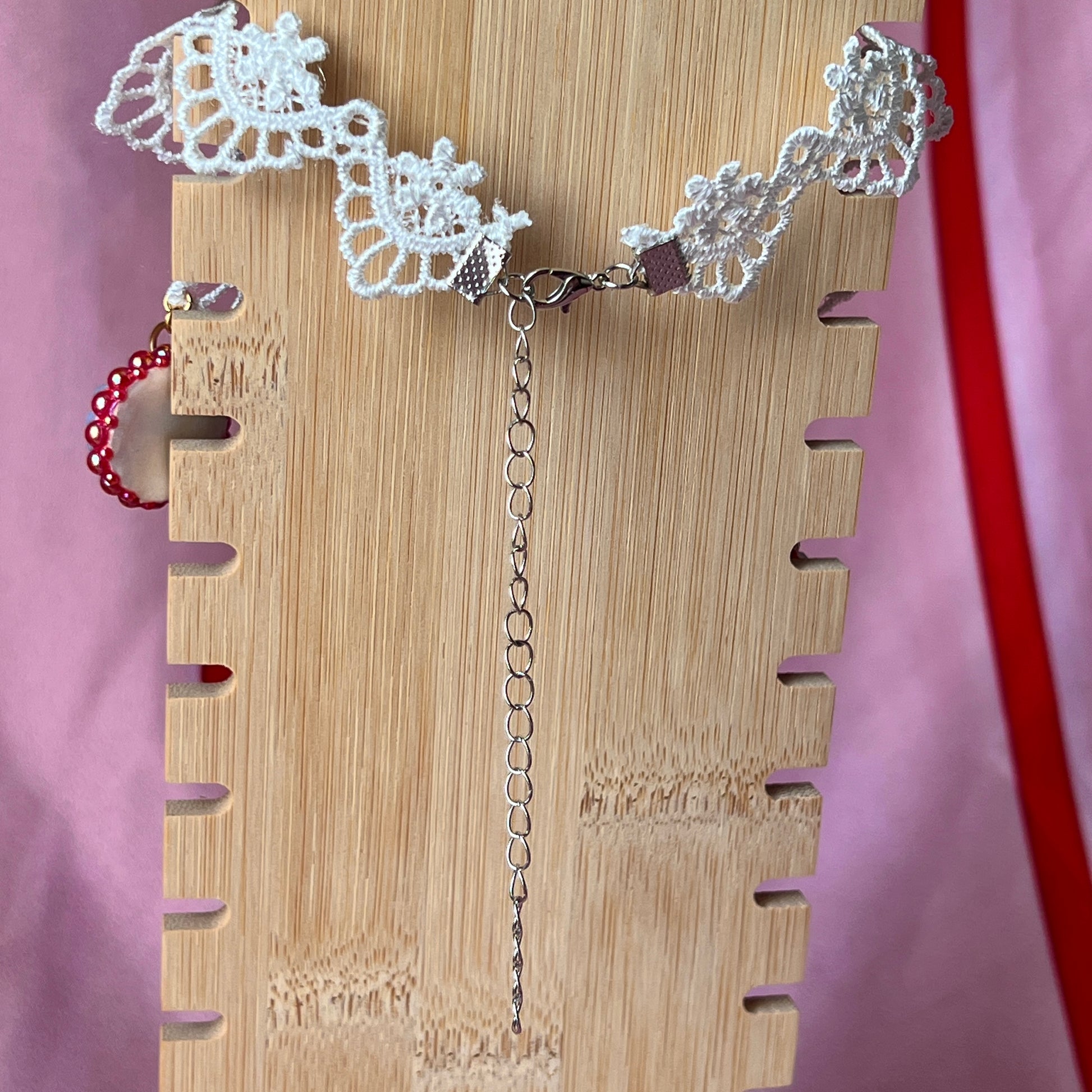 Armored Elf lace choker necklace — handmade polymer clay 3-charm “armored collage” bedazzled with iridescent beads on white lace choker. Gift-ready green Victorian-patterned box. Whimsigoth fairycore coquette cottagecore Y2K choker; ready to ship in 1–3 business days.