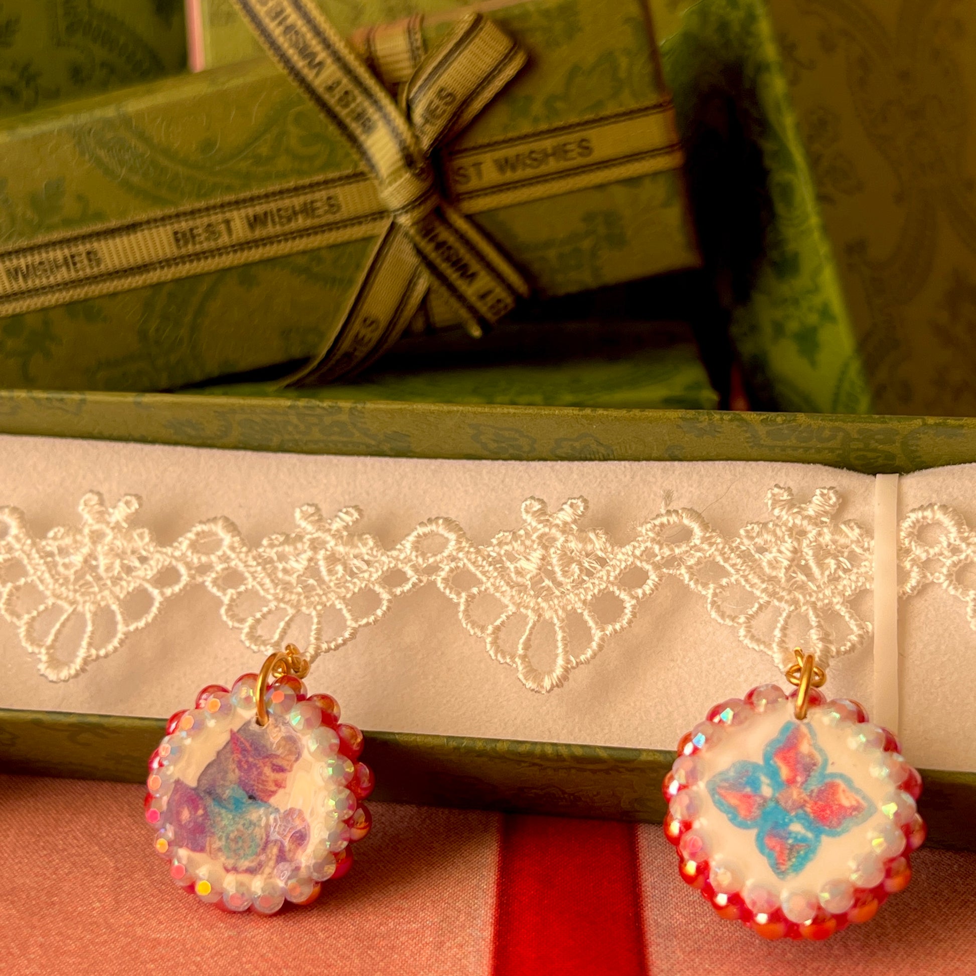Armored Elf lace choker necklace — handmade polymer clay 3-charm “armored collage” bedazzled with iridescent beads on white lace choker. Gift-ready green Victorian-patterned box. Whimsigoth fairycore coquette cottagecore Y2K choker; ready to ship in 1–3 business days.