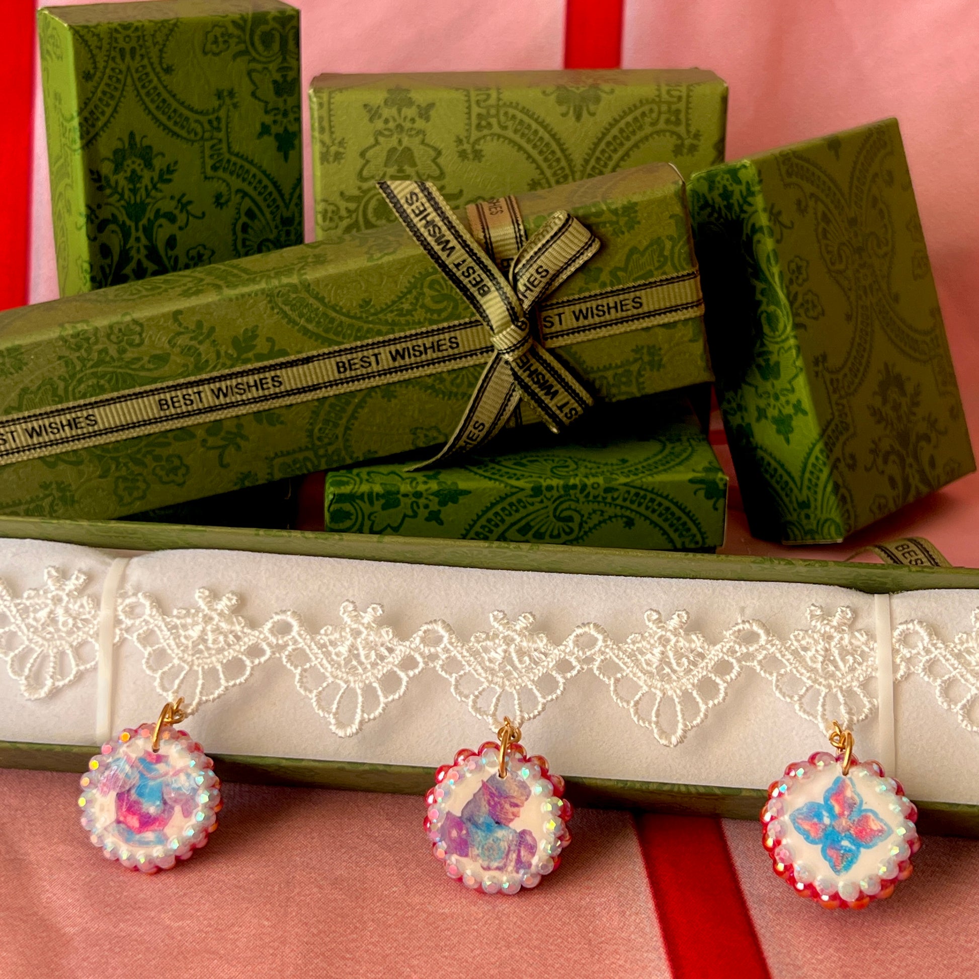 Armored Elf lace choker necklace — handmade polymer clay 3-charm “armored collage” bedazzled with iridescent beads on white lace choker. Gift-ready green Victorian-patterned box. Whimsigoth fairycore coquette cottagecore Y2K choker; ready to ship in 1–3 business days.