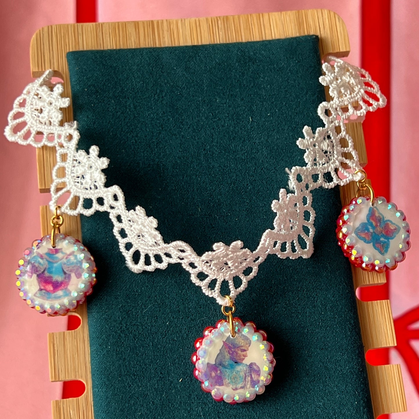 Armored Elf lace choker necklace — handmade polymer clay 3-charm “armored collage” bedazzled with iridescent beads on white lace choker. Gift-ready green Victorian-patterned box. Whimsigoth fairycore coquette cottagecore Y2K choker; ready to ship in 1–3 business days.