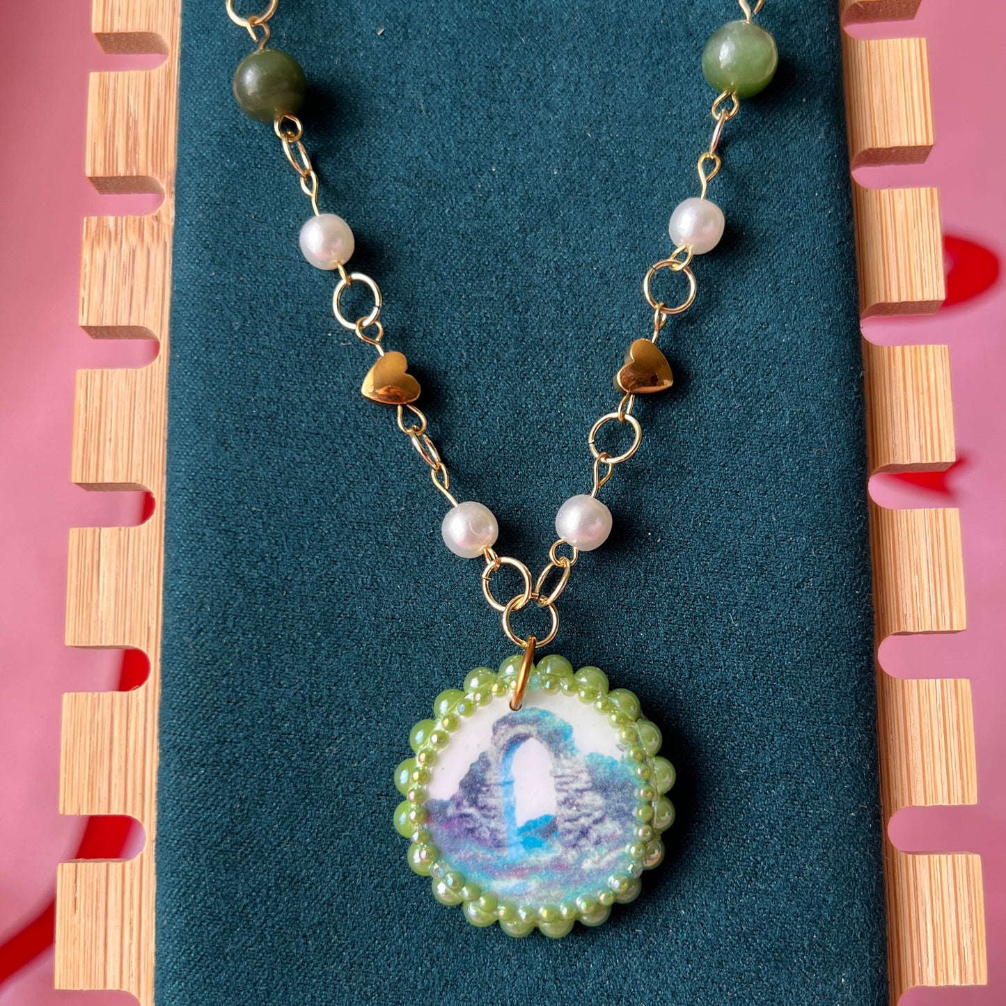 Magical archway charm necklace — one-of-a-kind medieval stone archway “portal” pendant hand-sculpted in polymer clay (approx. 1" tall x 0.75" wide) and bedazzled with iridescent pearls and rhinestones. Handmade wearable magic.