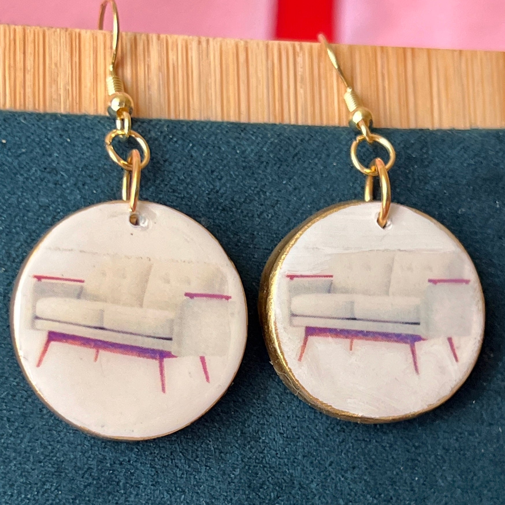 Handmade white couch earrings—polymer‑clay mini sofa charms painted with metallic gold, featuring gold‑plated hypoallergenic hooks; perfect retro Y2K dreamcore jewelry for quirky, miniature‑object lovers.