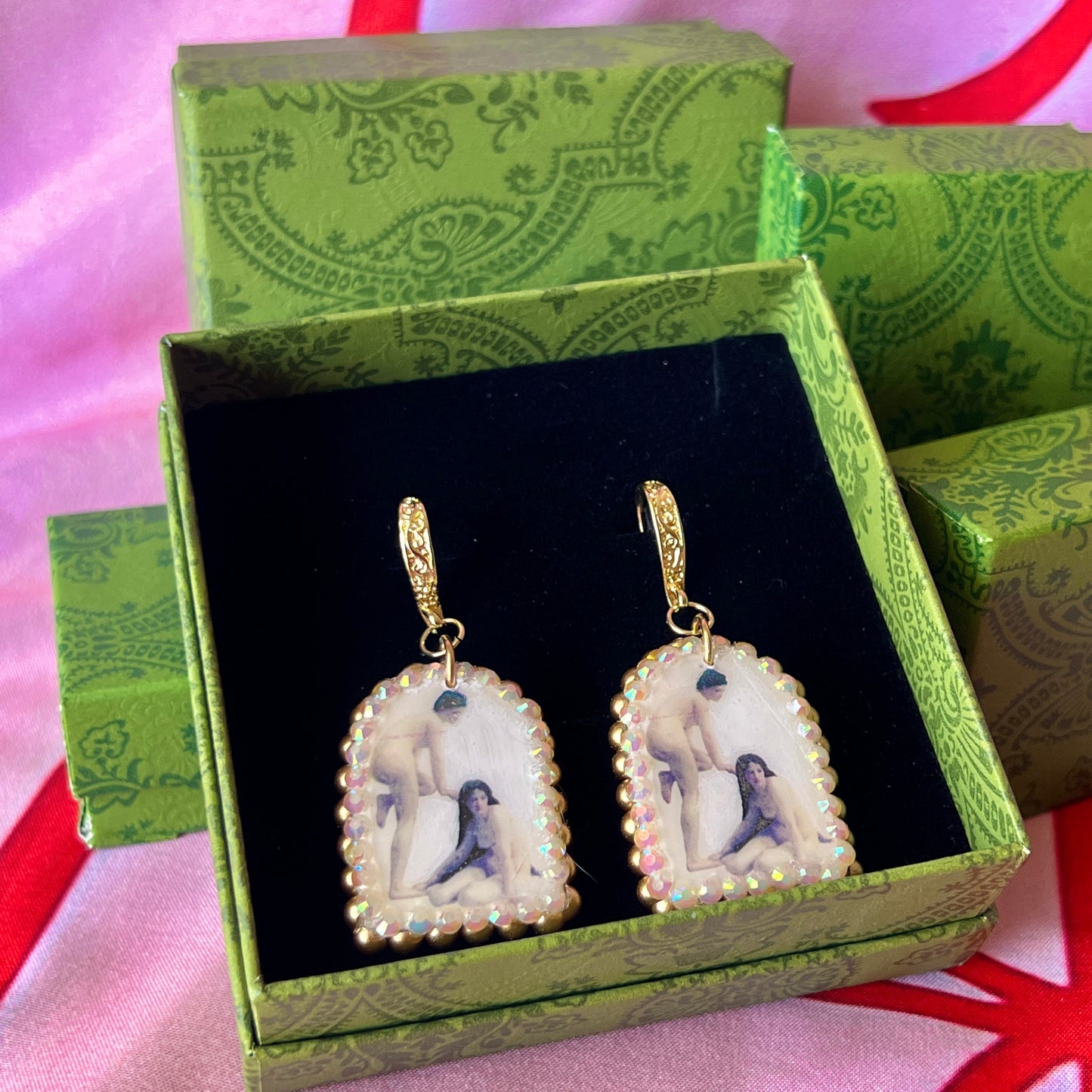 A wearable‑art pair of Bouguereau Bathers earrings — white polymer‑clay arch charms printed with “The Bathers” artwork, embellished with gold pearls and clear rhinestones, on 18k gold‑plated hooks; perfect museum‑core, renaissance‑core, coquette statement earrings for art lovers.