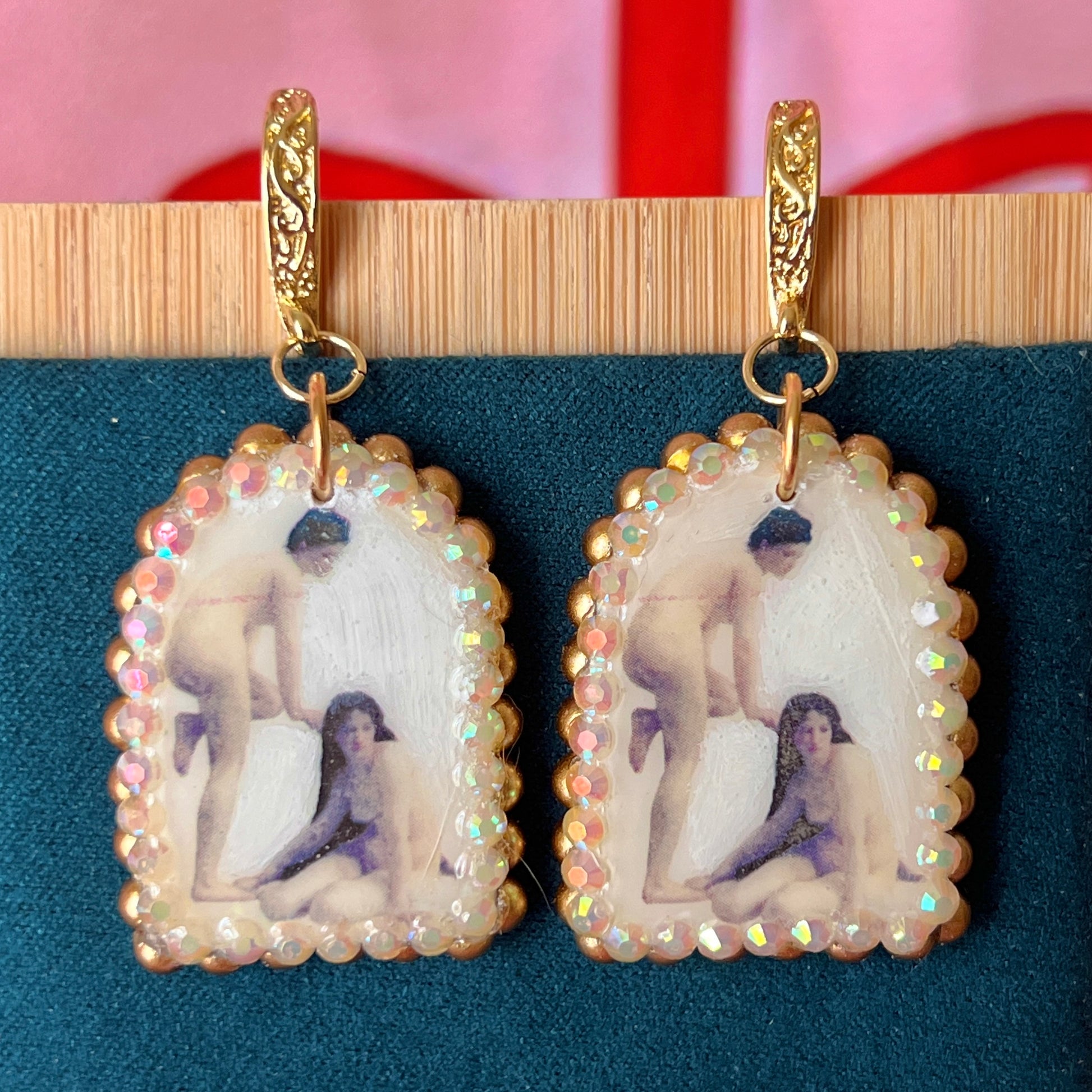 A wearable‑art pair of Bouguereau Bathers earrings — white polymer‑clay arch charms printed with “The Bathers” artwork, embellished with gold pearls and clear rhinestones, on 18k gold‑plated hooks; perfect museum‑core, renaissance‑core, coquette statement earrings for art lovers.