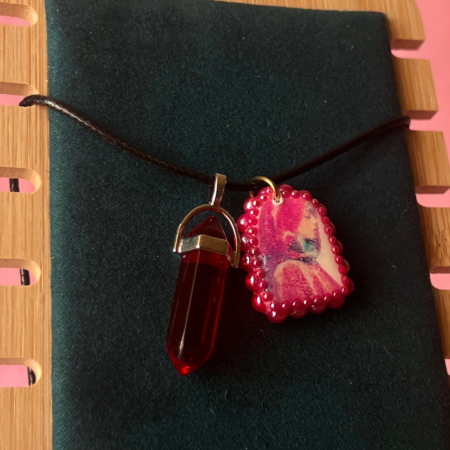 Red Riding Hood charm necklace — handmade polymer clay Red Riding Hood pendant hand-bedazzled with iridescent pearls + rhinestones, plus deep red crystal accent. Choose arch-shaped charm or square charm with burgundy + black gem drop. Gift-ready Victorian-patterned box. Fairycore goth Y2K dark fairytale jewelry; ready to ship in 1–3 days.