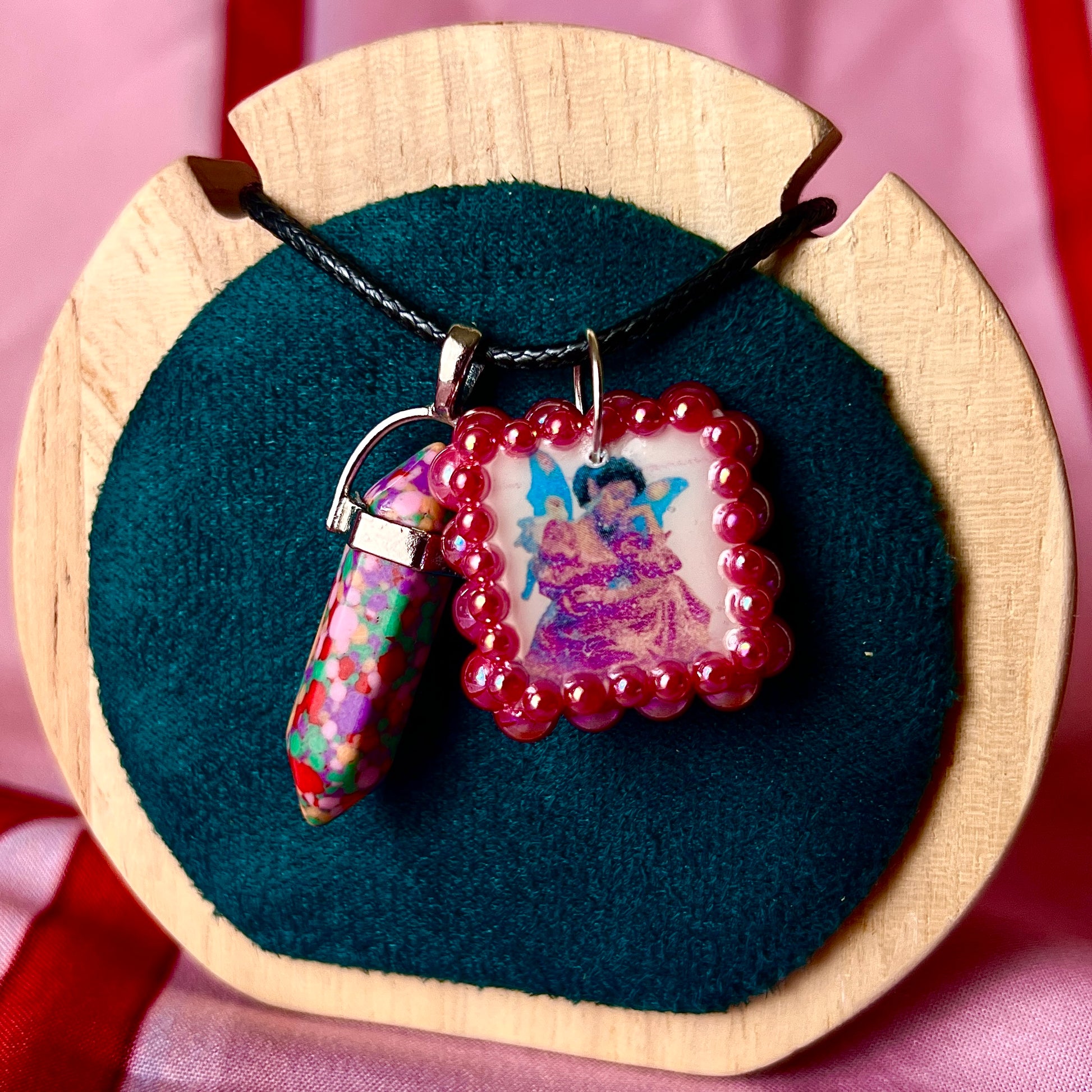 Confetti crystal fairy necklace — rainbow “confetti” crystal pendant paired with tiny blue fairy charm, hand-bedazzled with iridescent pearls + rhinestones for portal sparkle. Gift-ready Victorian-patterned box. Fairycore whimsigoth Y2K charm necklace by Olive Made; ready to ship in 1–3 days.