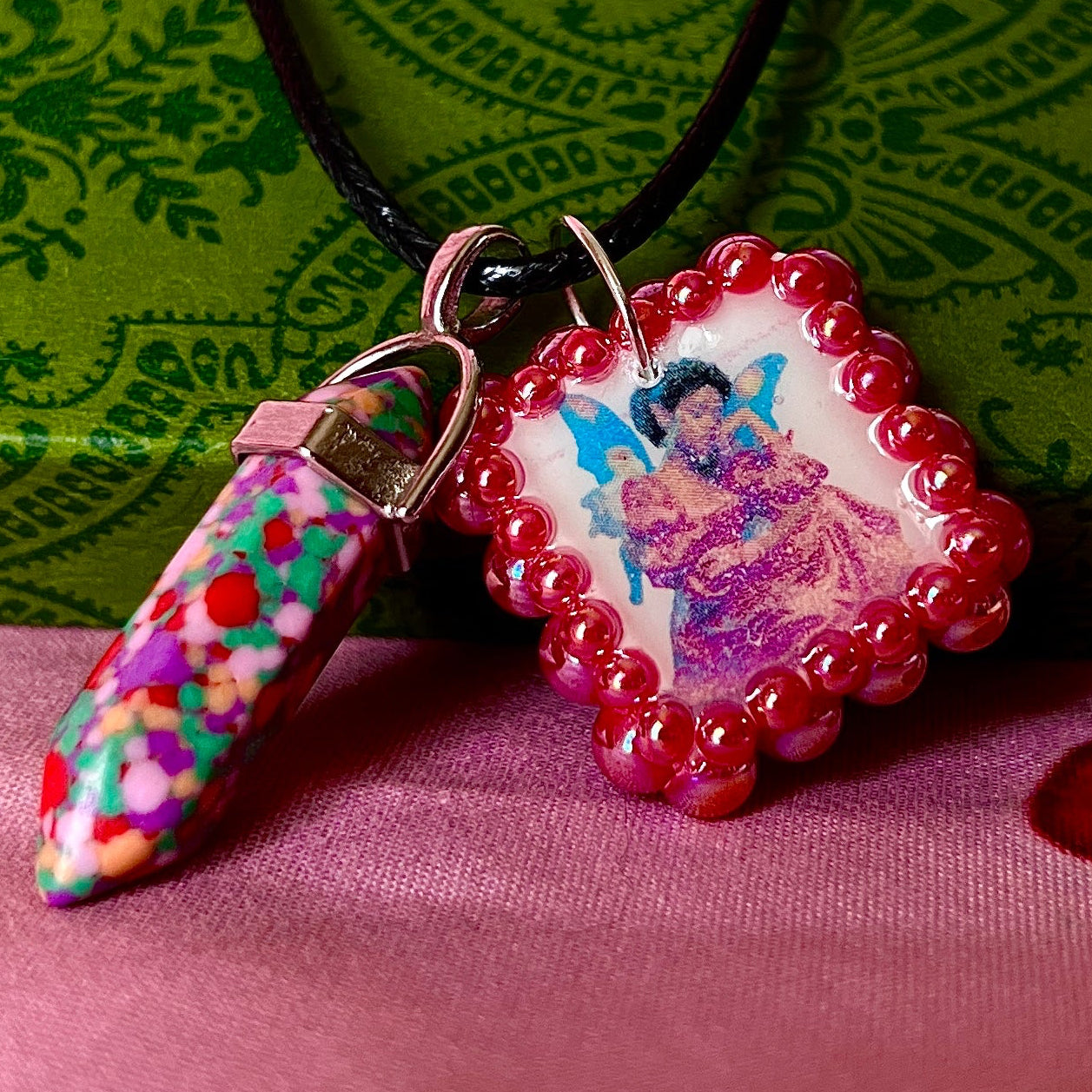 Confetti crystal fairy necklace — rainbow “confetti” crystal pendant paired with tiny blue fairy charm, hand-bedazzled with iridescent pearls + rhinestones for portal sparkle. Gift-ready Victorian-patterned box. Fairycore whimsigoth Y2K charm necklace by Olive Made; ready to ship in 1–3 days.