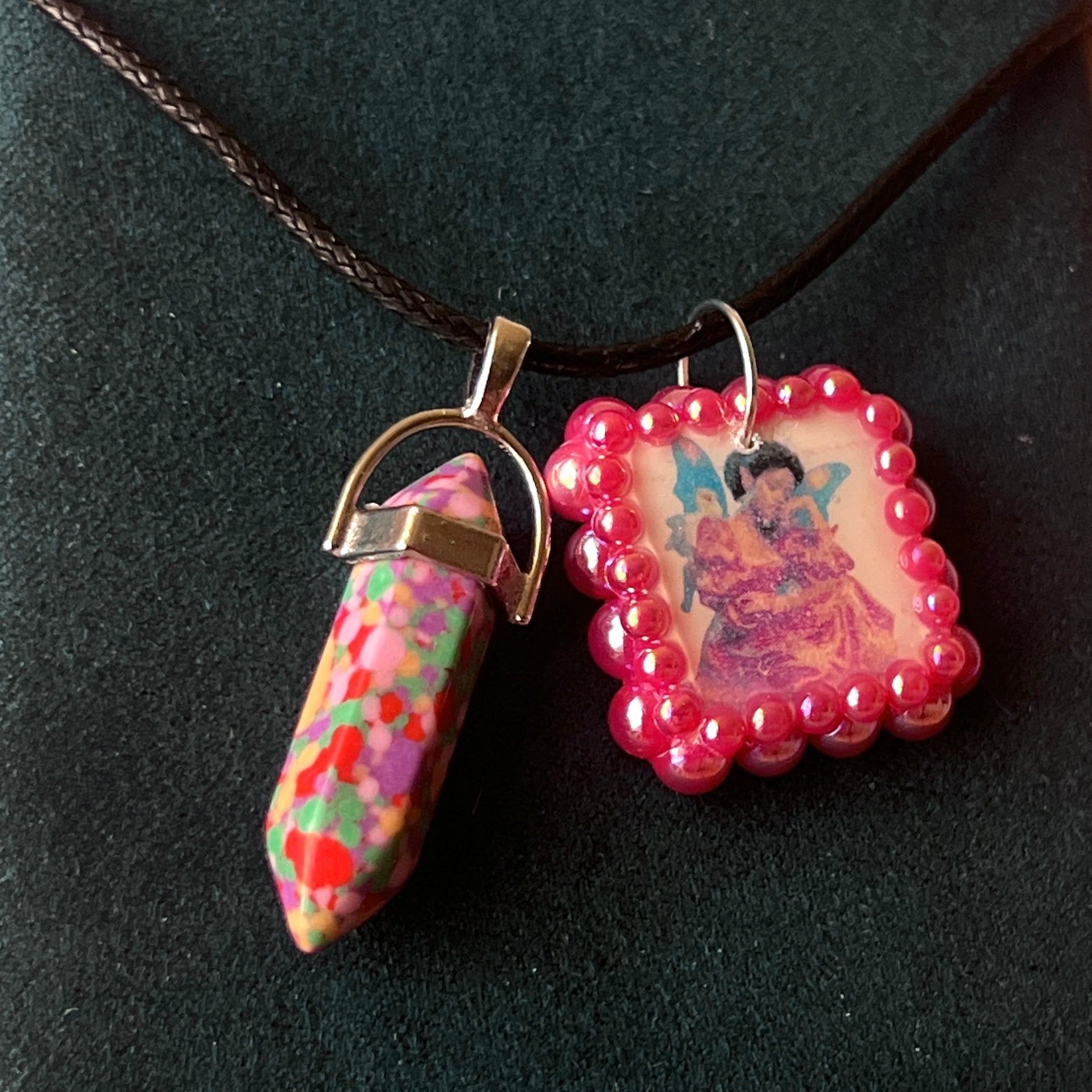 Confetti crystal fairy necklace — rainbow “confetti” crystal pendant paired with tiny blue fairy charm, hand-bedazzled with iridescent pearls + rhinestones for portal sparkle. Gift-ready Victorian-patterned box. Fairycore whimsigoth Y2K charm necklace by Olive Made; ready to ship in 1–3 days.