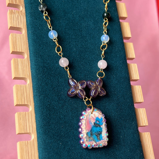Gold plated dragon charm necklace — one-of-a-kind beaded necklace with rose quartz, opalite, and Indian agate plus handmade iridescent polymer clay dragon charm bedazzled with iridescent pearls, dark purple pearls, and rhinestones. 18k gold-plated links; 20" length + 2" star extender. Ready to ship.
