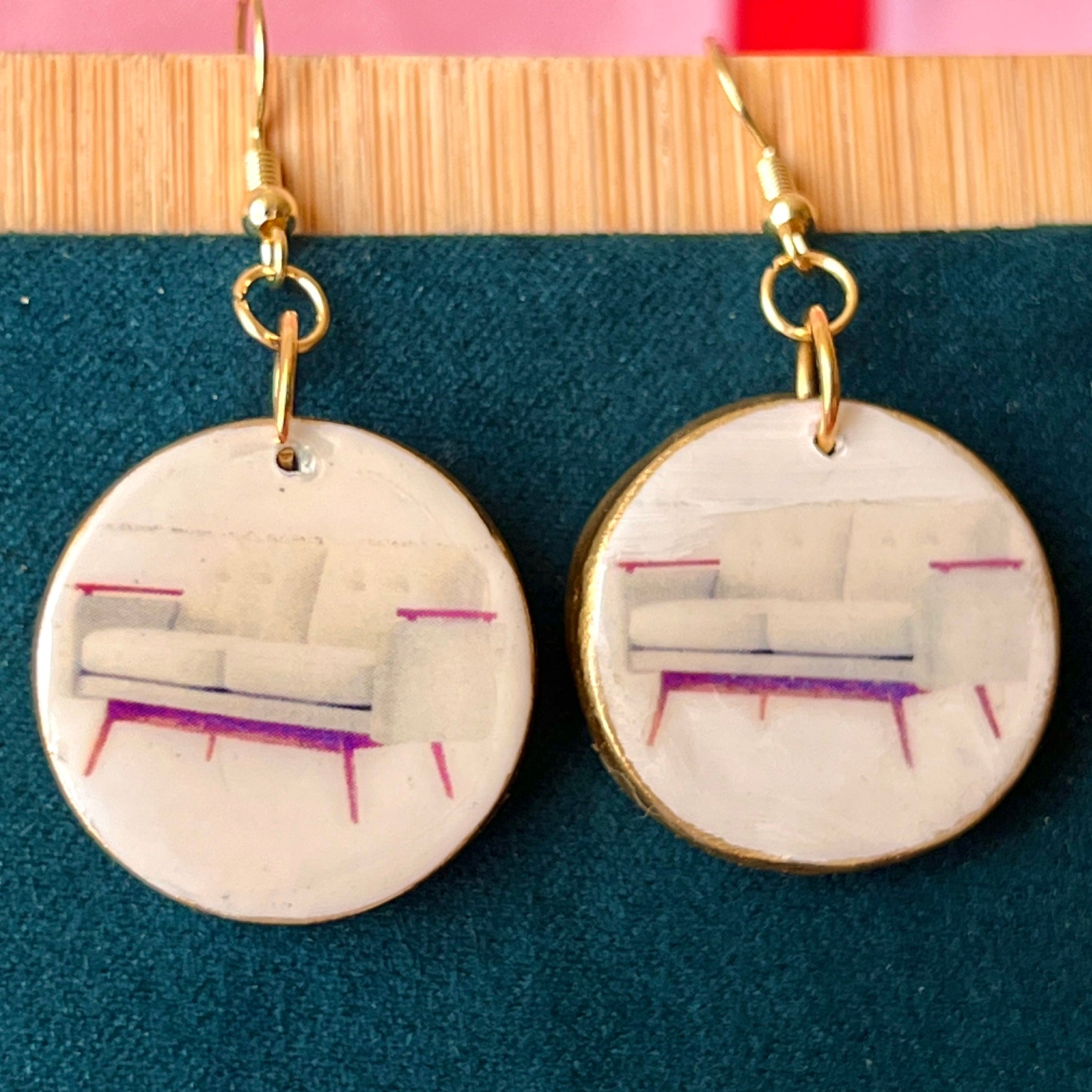 Handmade white couch earrings—polymer‑clay mini sofa charms painted with metallic gold, featuring gold‑plated hypoallergenic hooks; perfect retro Y2K dreamcore jewelry for quirky, miniature‑object lovers.