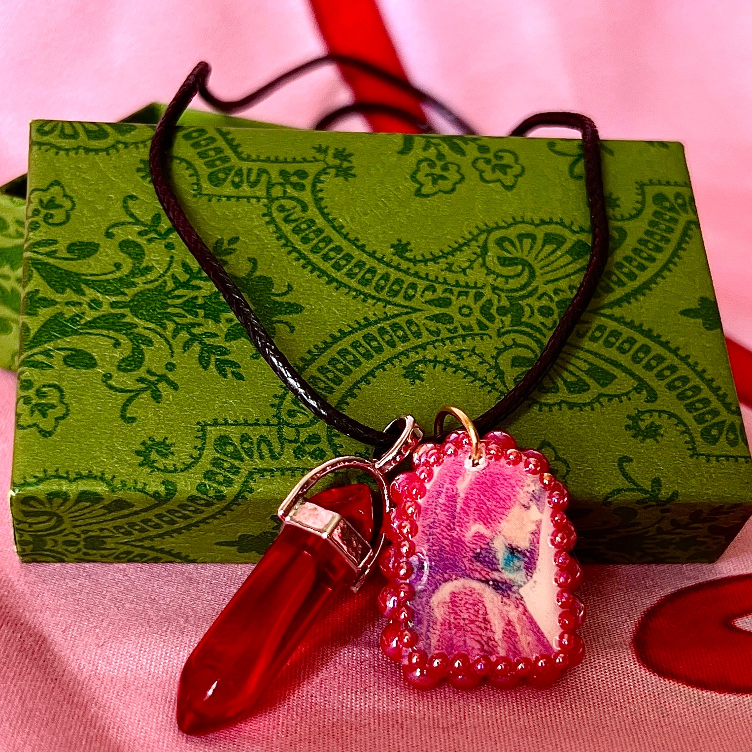 Red Riding Hood charm necklace — handmade polymer clay Red Riding Hood pendant hand-bedazzled with iridescent pearls + rhinestones, plus deep red crystal accent. Choose arch-shaped charm or square charm with burgundy + black gem drop. Gift-ready Victorian-patterned box. Fairycore goth Y2K dark fairytale jewelry; ready to ship in 1–3 days.
