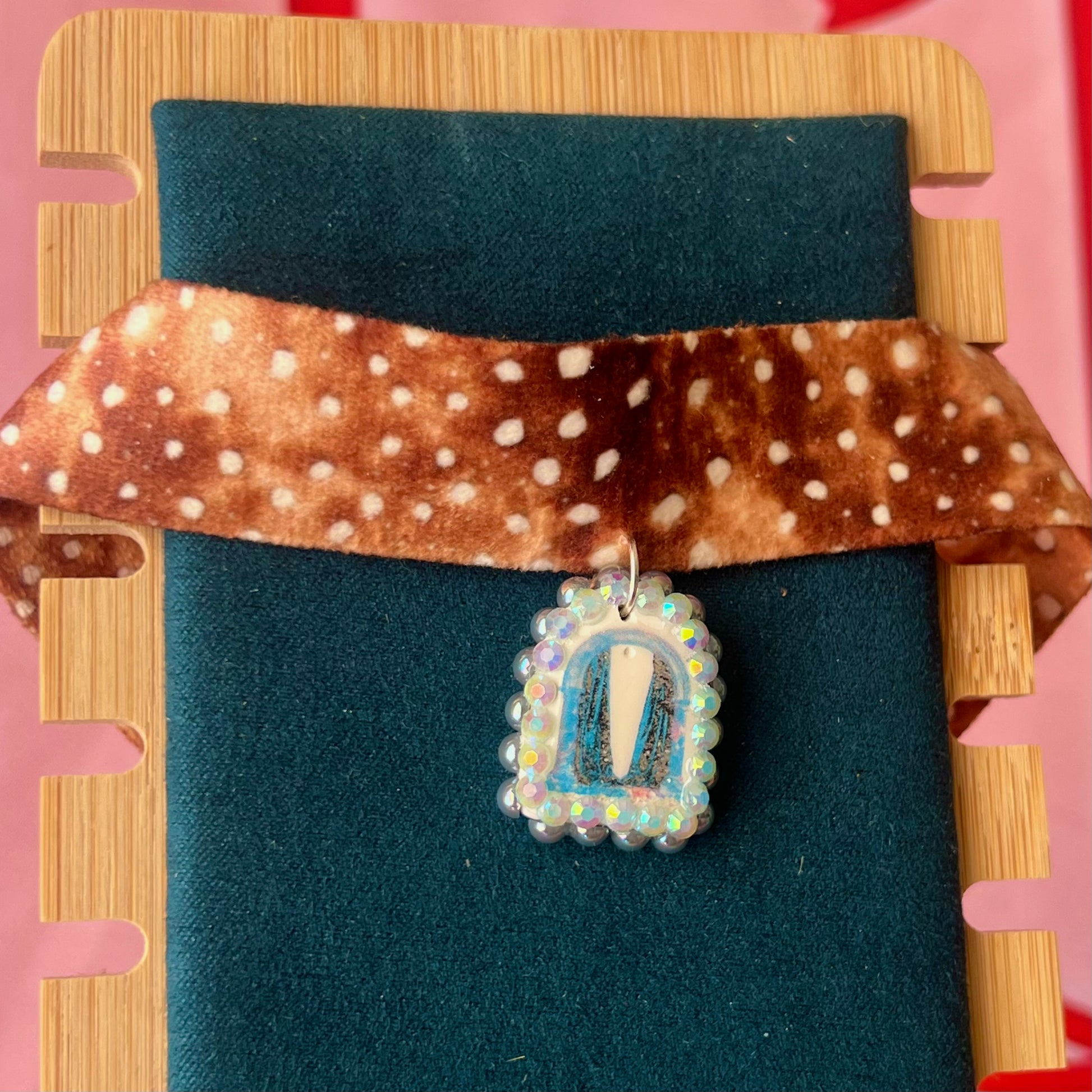 Deer print choker necklace — soft doe/deer print choker (adjustable 13–16") with handmade polymer clay liminal cloaked magic archway charm (approx. 1") bedazzled with iridescent pearls + rhinestones. Gift-ready Victorian-patterned box with green bow. Ready to ship in 1–3 days.