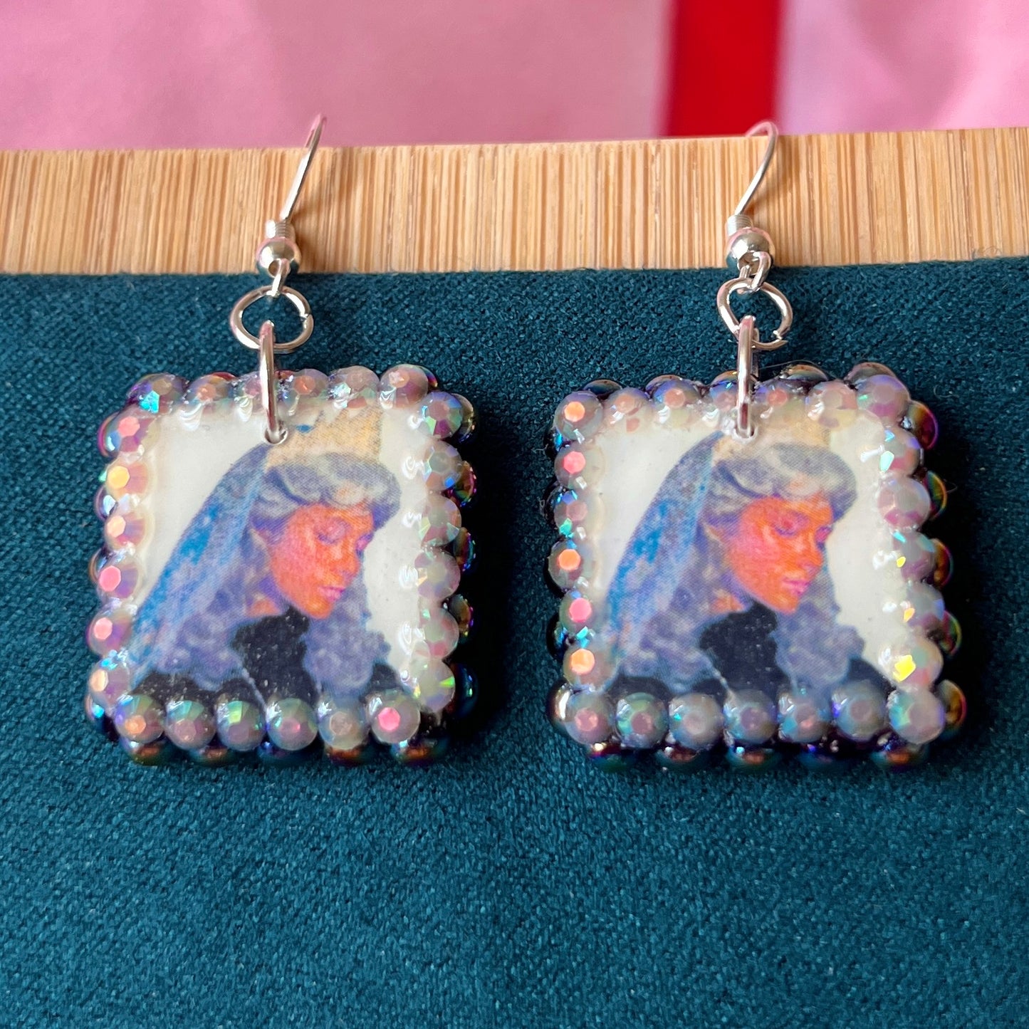 Alt text: Medieval-inspired enchanted princess earrings featuring handmade polymer‑clay character charms—blonde princess with veil or brunette princess with staff—bedazzled with iridescent pearls and rhinestones, set on silver‑plated hypoallergenic hooks; perfect fantasy, princesscore, and cosplay jewelry.