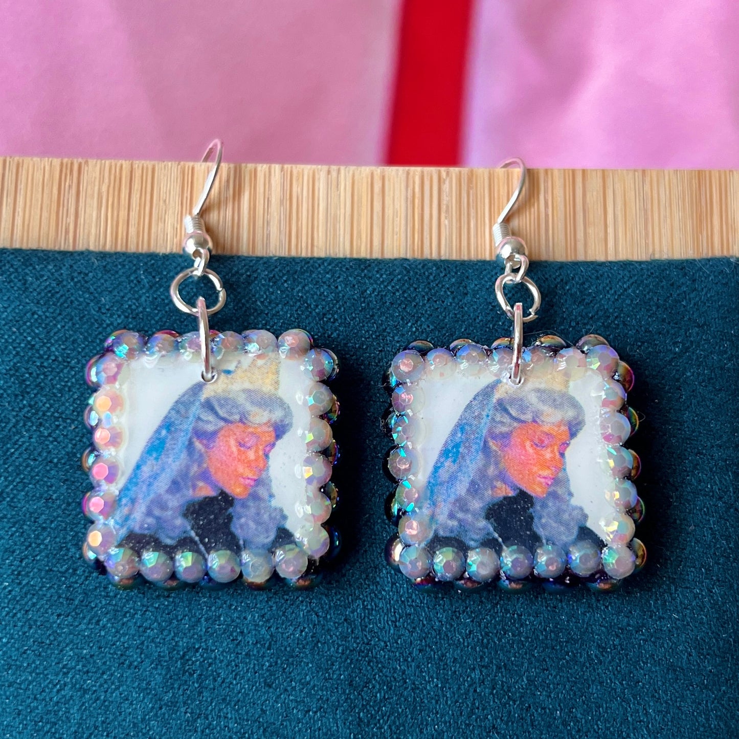 Alt text: Medieval-inspired enchanted princess earrings featuring handmade polymer‑clay character charms—blonde princess with veil or brunette princess with staff—bedazzled with iridescent pearls and rhinestones, set on silver‑plated hypoallergenic hooks; perfect fantasy, princesscore, and cosplay jewelry.