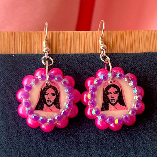 Alt text: Hot pink Y2K nun earrings featuring handmade polymer clay charms bedazzled with iridescent beads, silver plated hypoallergenic hooks, and whimsical gothic, grunge, punk, pink, Y2K style—perfect gift‑ready earrings in a cute green Victorian‑patterned box.