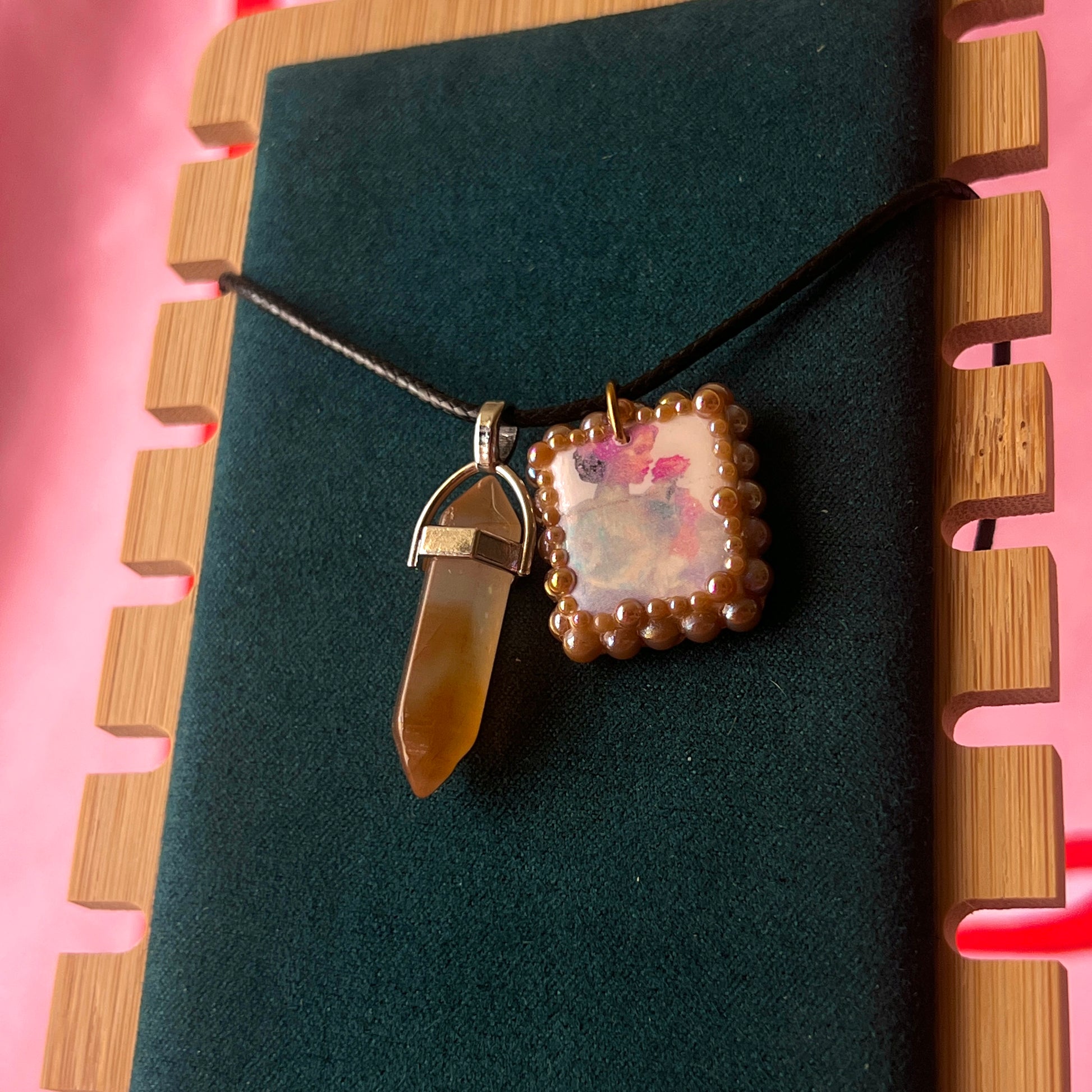Bedazzled iridescent princess necklace — handmade polymer clay Fairy Princess or Flower Princess charm with iridescent glitter backing, bronze-toned pearl bead bedazzling, and gemstone drop pendant on 22" faux leather chain with adjustable extender. Romantic Y2K fairycore coquette statement necklace by Olive Made.
