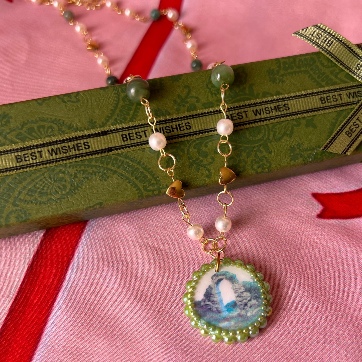 Magical archway charm necklace — one-of-a-kind medieval stone archway “portal” pendant hand-sculpted in polymer clay (approx. 1" tall x 0.75" wide) and bedazzled with iridescent pearls and rhinestones. Handmade wearable magic.
