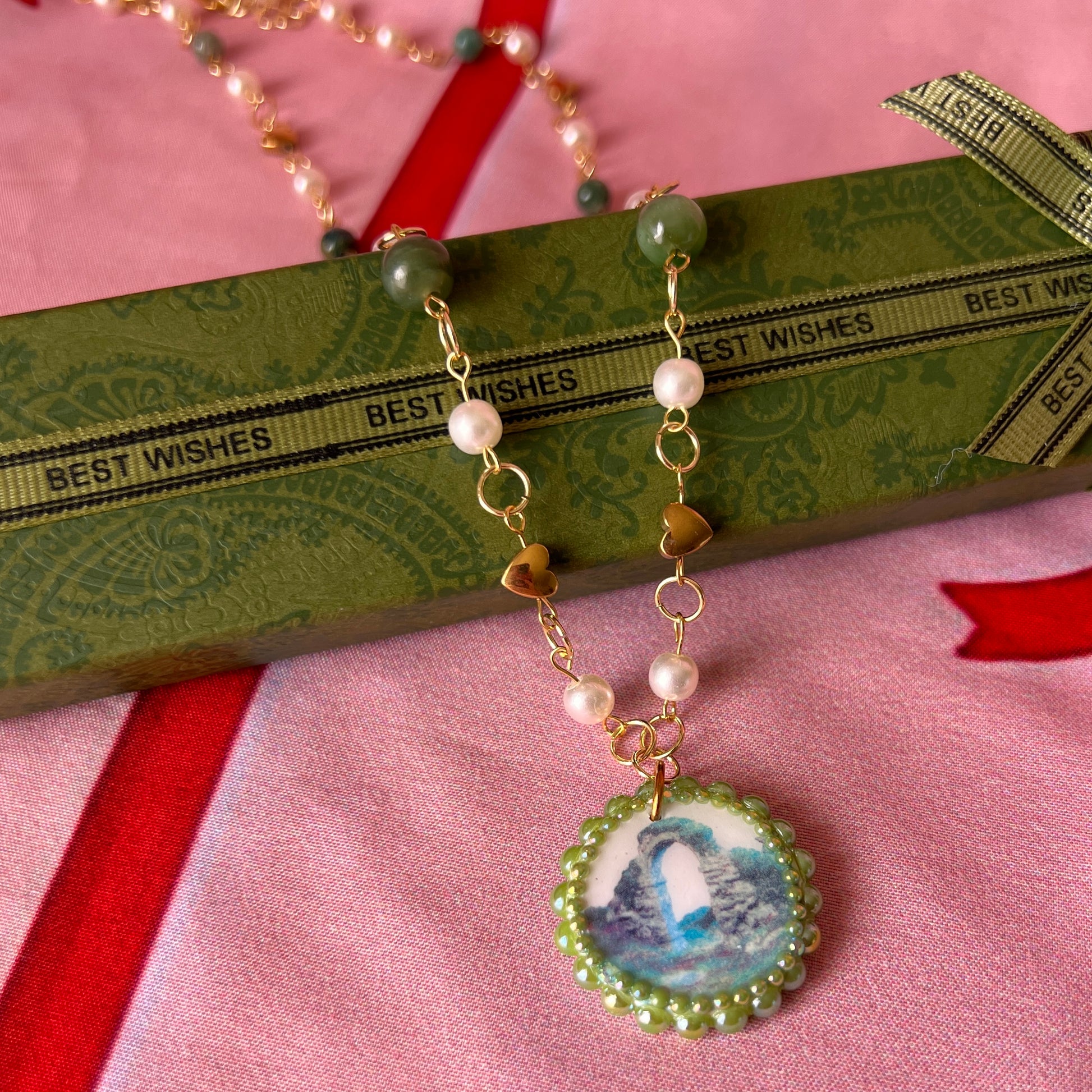 Magical archway charm necklace — one-of-a-kind medieval stone archway “portal” pendant hand-sculpted in polymer clay (approx. 1" tall x 0.75" wide) and bedazzled with iridescent pearls and rhinestones. Handmade wearable magic.