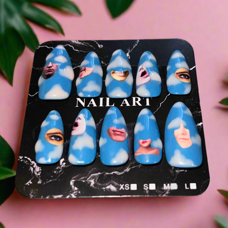 Pack of blue nail art designs with faces on a pink background