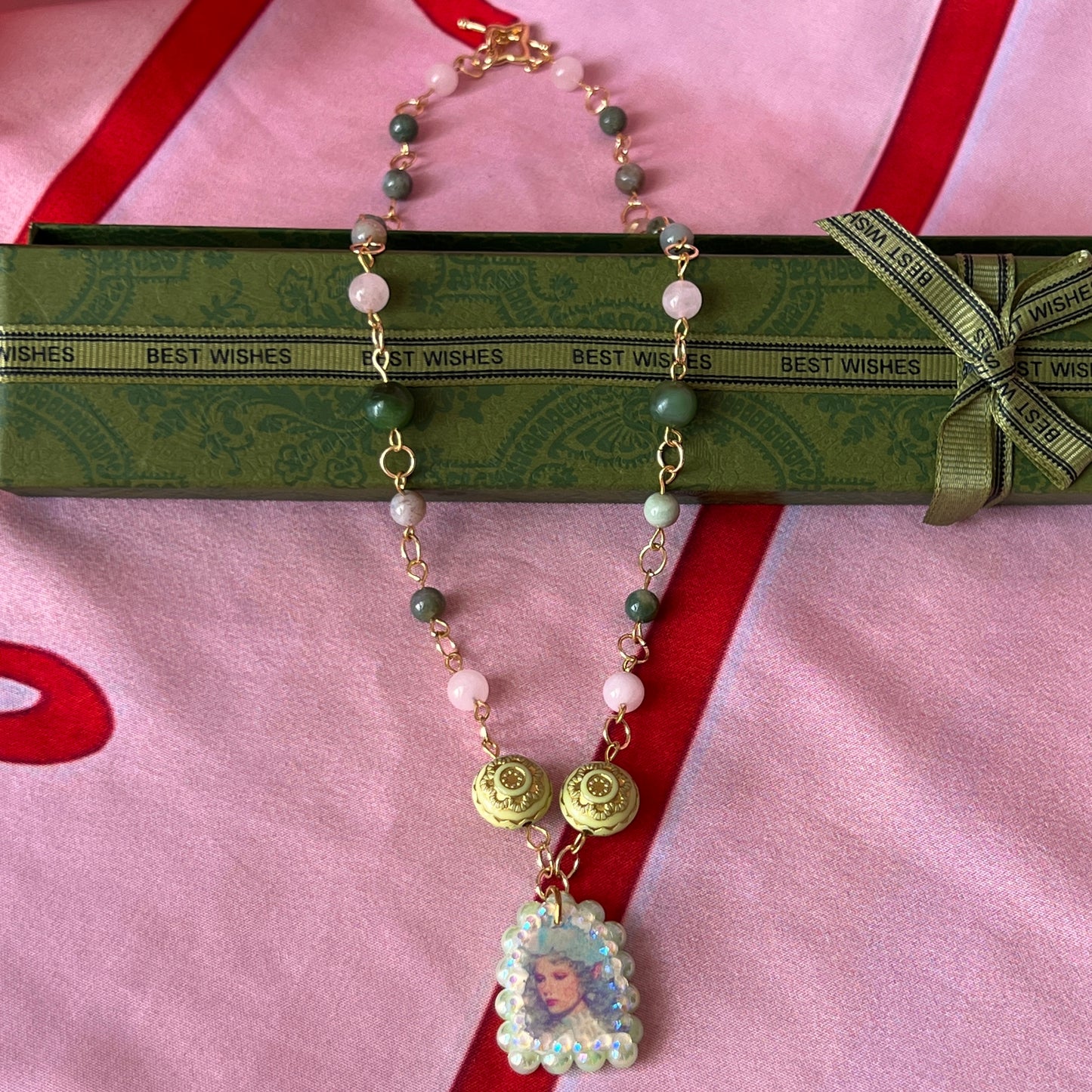 Fairycore crystal portrait necklace — 20" beaded necklace with rose quartz, Indian agate, and upcycled rutilated quartz plus handmade iridescent bedazzled portrait charm. 18k gold plated findings + 18k gold filled jump rings; ornate toggle clasp. Gift-ready green Victorian-style box; ready to ship.