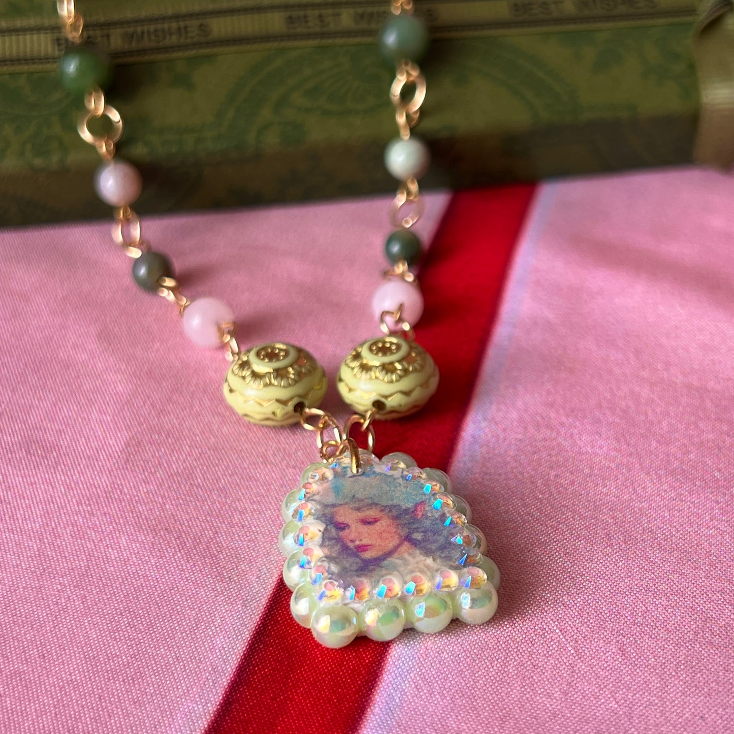 Fairycore crystal portrait necklace — 20" beaded necklace with rose quartz, Indian agate, and upcycled rutilated quartz plus handmade iridescent bedazzled portrait charm. 18k gold plated findings + 18k gold filled jump rings; ornate toggle clasp. Gift-ready green Victorian-style box; ready to ship.